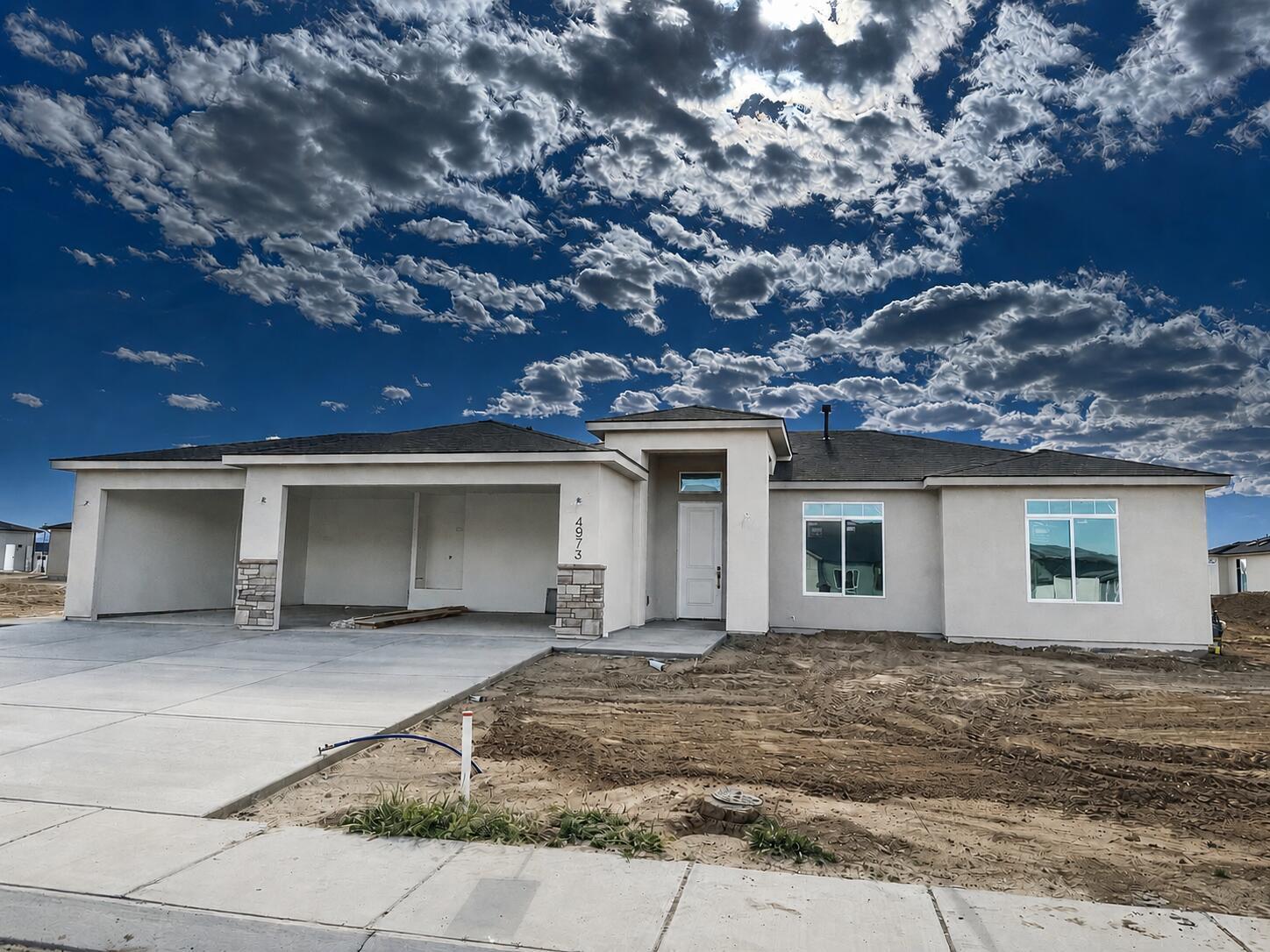 Introducing the Slate floor plan, this beautiful single-level residence offers three bedrooms and two and a half baths. This home includes a spacious three-car garage, an open floor plan designed for modern living, and a covered patio for outdoor enjoyment. The kitchen boasts an island and a walk-in pantry, enhancing both functionality and style. Additional features include a dedicated laundry room, and a master suite equipped with double sinks and a walk-in closet. Perfect for those seeking convenience and comfort in a thoughtfully designed space.