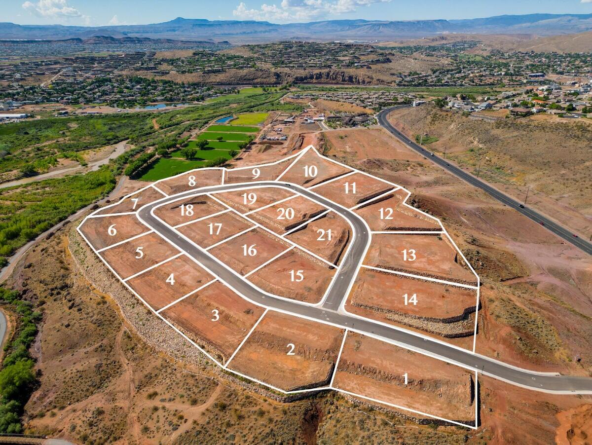 Where do we begin? The Views... the kind that make you want to slow your morning. With a due north backyard, your panorama stretches from Pine Valley Mountain to Cedar Mountain and Zion layered on the horizon. Set within an exclusive 21-home hilltop enclave, this lot offers rare privacy just minutes from St. George's best dining and shopping. The staggered, stadium-style layout protects both seclusion and scenery. Includes ready-to-build plans, or start fresh and design your dream from scratch. Built by award-winning Strata Custom Homes. Vacation living, every day!