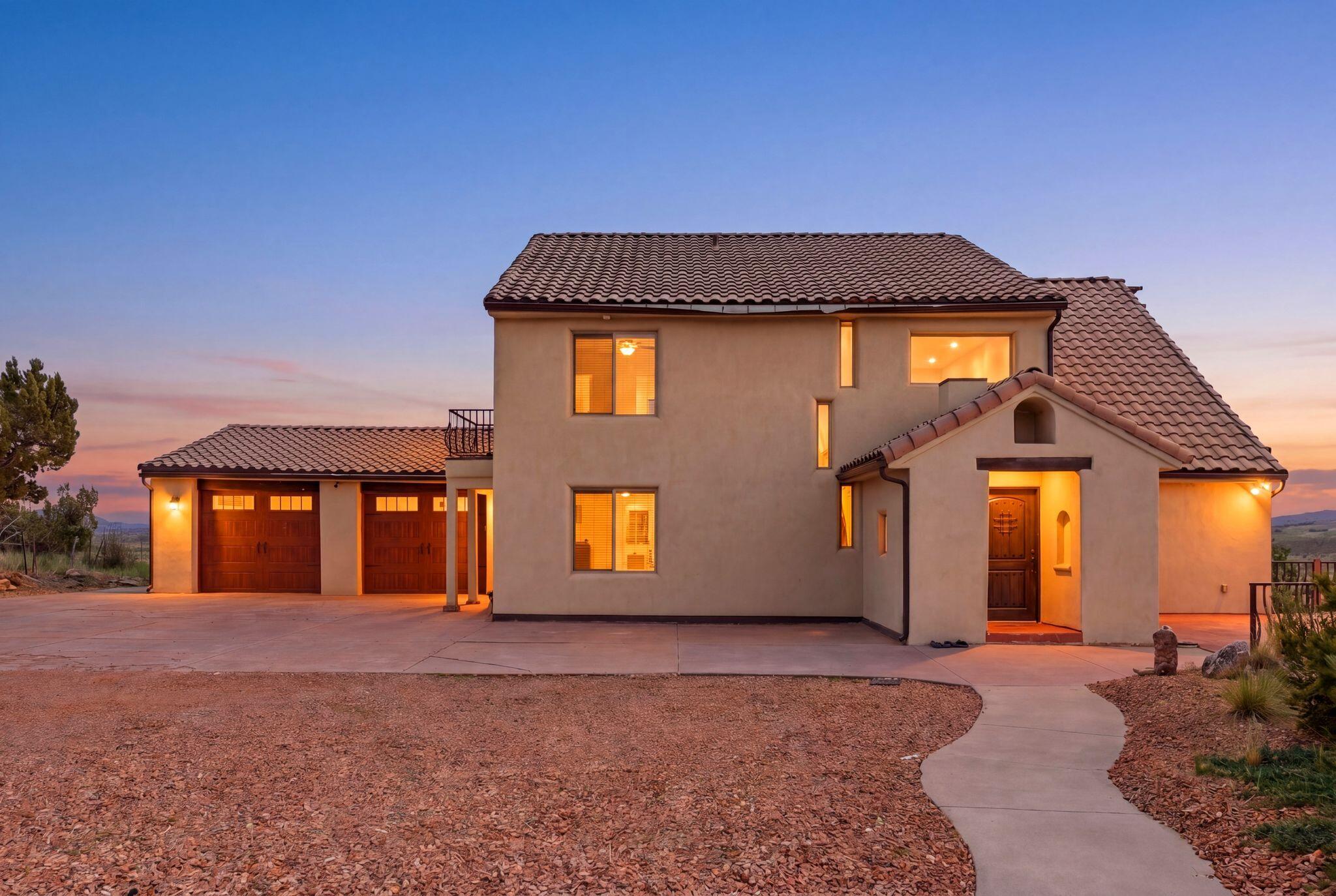 Escape the pace of city life and discover a peaceful retreat in beautiful Alton, Utah, where breathtaking views, quiet surroundings and outdoor adventure come together. Set on a 1.65-acre lot and offering 4,357 square feet, this unique five-bedroom, four-bathroom property is designed for gathering, relaxing and making lasting memories.  The main level welcomes you with a foyer entry, vaulted great room filled with natural light, a fireplace, semi-formal dining area and an open kitchen with pantry, offering plenty of space to cook and entertain. Just off the kitchen, the laundry/mudroom features a stackable washer and dryer, sink, storage and sit-down bench with convenient access to the two-car garage. The main-level owner's en-suite includes a walk-in closet, while an expanded balcony showcases serene, wide-open views.  Upstairs, a loft-style entertainment area offers walkout access to a private balcony, along with two additional bedrooms connected by a Jack-and-Jill bathroom. The lower level is built for fun and flexibility, featuring a spacious living room with a second fireplace, pool table, kitchenette with pantry/storage, stackable washer and dryer, two bedrooms, a full bathroom and an additional bunk room or flex space. Walk out to the backyard and enjoy the hot tub, grass area, fire pit seating, playground and unforgettable views.  With mini-splits, radiant heat, a two-car garage with storage and nightly rentals allowed, this one-of-a-kind Alton retreat offers the perfect blend of peaceful personal escape, guest-friendly design and investment potential near Dixie National Forest, Brian Head, Cedar City, St. George and endless outdoor recreation.