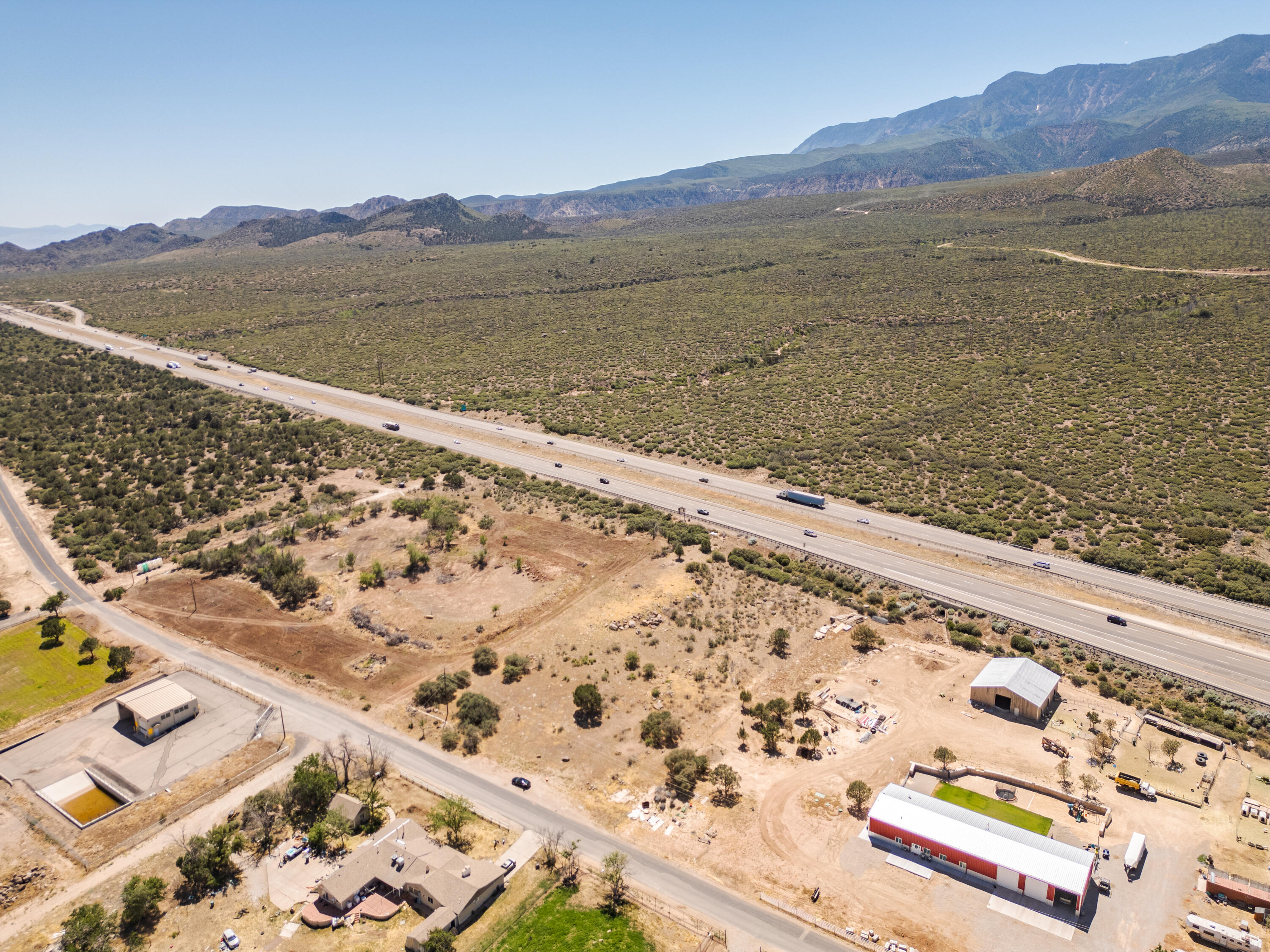 Seller Financing possible. Freeway visibility vacant land from I-15. Located off of off ramp #31. Go east of freeway then turn right on 100 E. Property will be on the right. Zoned RA-1 for residential or commercial use on General Plan map. Possible water share from Pintura Irrigation Company. Need to buyer a water right & drill a water well. Pressurized water. Commercial use next door.