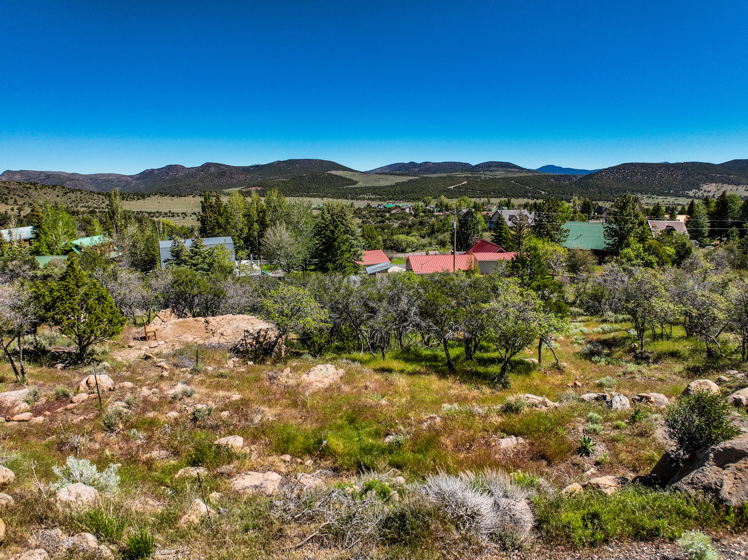 Spectacular opportunity to save over $30,000 with improvements already in place including an installed septic tank and water hook up fee paid. Build your dream home on one of the few remaining elevated view lots in the valley, featuring breathtaking unobstructed views and a beautifully wooded setting with mature mahogany and oak trees.

Located in the peaceful mountain community of Pine Valley at 6,700 feet elevation, just 35 miles from St. George, this property offers quiet mountain living surrounded by deer, turkey, and abundant birdlife. Pine Valley is known for having some of the best drinking water in the state along with exceptionally low power costs.

Unique custom building plans designed to maximize the use of the property are available upon request. A rare chance to own a premium view lot in one of Southern Utah's most scenic mountain communities.