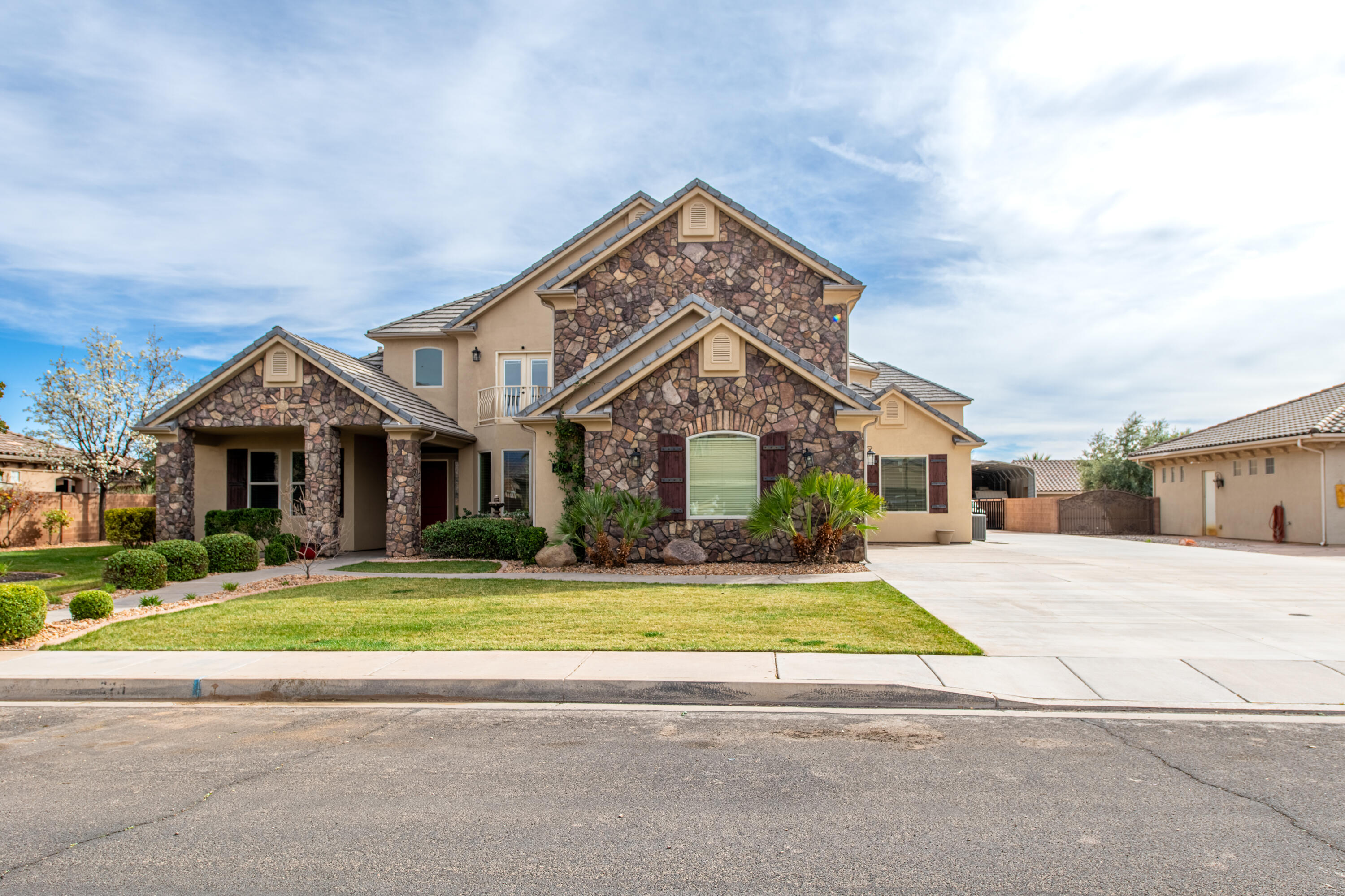 Welcome to 325 W River Willow Ln in Washington, UT--an exceptional property offering space, flexibility, and standout amenities on a private 0.57-acre lot. With 10 bedrooms, 8 bathrooms, approximately 6,681 sq ft, and a rare attached casita/ADU, this home is ideal for multi-generational living, hosting guests, or buyers seeking a layout with possible residual income potential. feel confident in this homes value as it was recently appraised, just prior to listing, and is priced below the appraised amount. 

The casita is a standout feature with its own 2-car garage, 2 bedrooms, 2 bathrooms, living space, and private functionality that makes it perfect as a guest house, private quarters, or flexible secondary living space. Combined with the main home's 3-car garage, the property offers an impressive total of 5 garage spaces.

Inside, the main residence offers warm, inviting living areas with abundant natural light, a beautiful fireplace, spacious gathering rooms, and a well-appointed kitchen with extensive cabinetry, large island seating, and room to entertain. The floor plan balances open-concept living with private spaces, while the main-level primary suite adds convenience and comfort. Thoughtful finishes, tall ceilings, and expansive windows create an airy, upscale feel throughout.

Step outside to a backyard designed for relaxation and recreation. The private pool and hot tub are enhanced by a beautiful waterfall feature, creating a resort-style setting for enjoying Southern Utah living. The large yard offers room for entertaining, play, or gatherings, with space for activities like volleyball. Garden boxes add charm and function for buyers who enjoy gardening. Mature landscaping, open patio space, and the versatile outdoor layout make this property as impressive outside as it is inside.

Located in a desirable Washington neighborhood near schools, shopping, and recreation, this home combines luxury, versatility, and lifestyle in one rare offering.