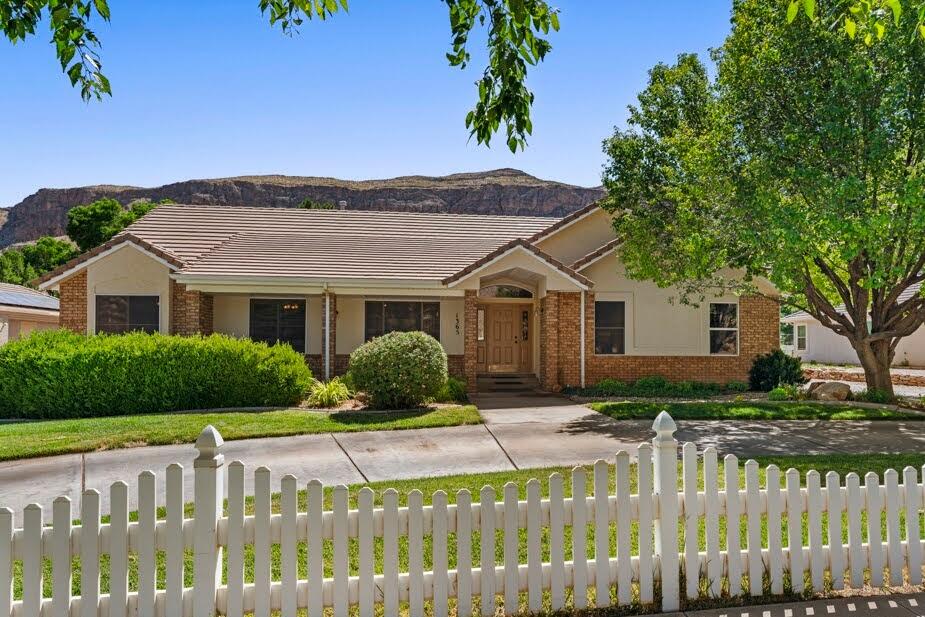 Discover your ultimate Southern Utah lifestyle in this rare main-level living masterpiece with upgrades inside and out. Located on the serene Sycamore Lane within Roberts Ranch Estates, this immaculate .60-acre estate offers breathtaking views and a coveted east-facing backyard for shaded afternoon relaxation--all with NO HOA.

With nearly 4,000 sq. ft. of living space, this home features a spacious open floor plan. The main level includes 3 bedrooms and 2 baths, while the finished basement provides 3 additional bedrooms, a family room, and a versatile hobby or flex-room--perfect for an art studio, quilting room, or home office. Flex room could be converted to kitchenette with the available 220 power.

The park-like grounds are a private orchard paradise featuring peach, apricot, almond, and pomegranate trees. Adventure-ready with an oversized detached metal carport providing sought-after covered RV parking or for your boat or toys. Enjoy the peace of the Hurricane Fields with quick access to Sand Hollow and Zion National Park. Your turn-key home or retreat awaits!