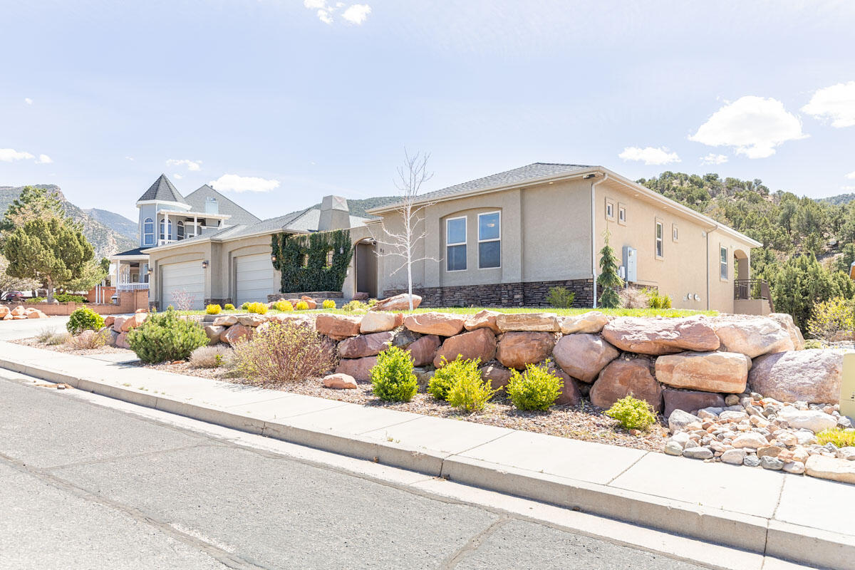 Luxury living in the heart of Fiddlers Canyon. This exceptional custom estate offers 6,488 sq ft on a beautifully landscaped 0.64-acre lot, blending quality construction, thoughtful design, and elevated comfort.
The home features 5 bedrooms, 4.5 bathrooms, a gourmet kitchen with commercial-grade appliances, and expansive living spaces designed for both everyday living, and entertaining. The main-level primary suite includes a private sitting area, spa-style bath with steam shower and jetted tub, and direct access to the laundry.
The fully finished walkout basement provides additional living space, a theater room, wet bar, and private guest accommodations with separate access--ideal for multi-generational living or extended stays.
Built with enhanced insulation, three HVAC systems, and soundboard construction for comfort and efficiency. Additional features include a heated 4-car garage with epoxy floors and 220 power, detached shop, RV parking, central vacuum, reverse osmosis system, whole-home audio, electronic lighting controls, and security system.
Outdoor living includes a private enclosed courtyard with fireplace, covered patio and deck, and mature landscaping designed for year-round enjoyment.
Located in one of Cedar City's most desirable areas, with convenient access to trails, and outdoor recreation.