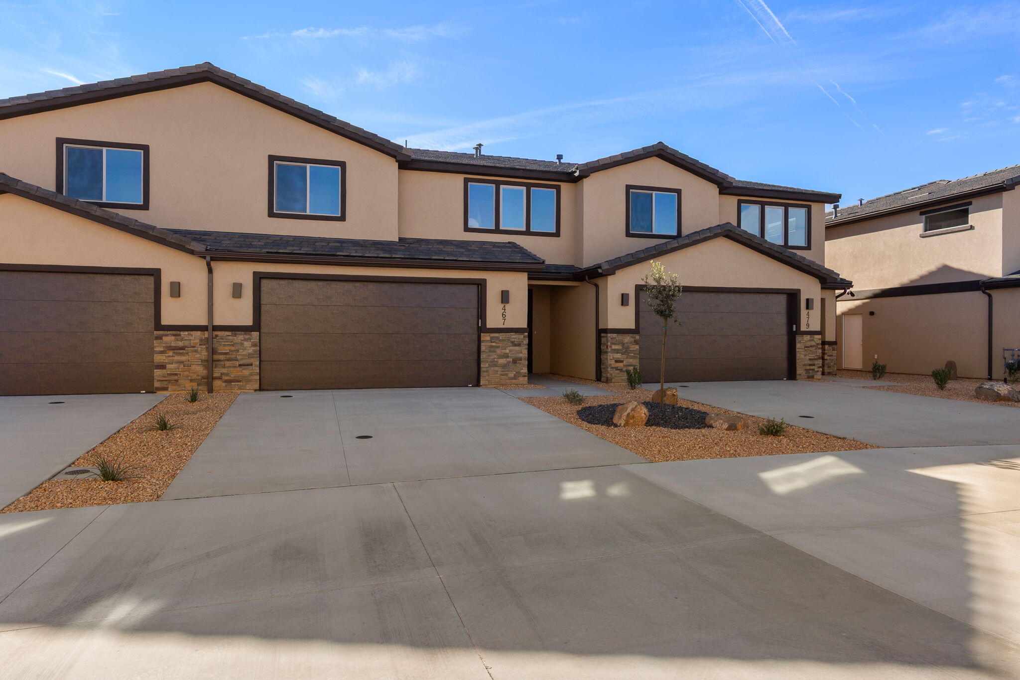 Brand new and beautifully designed townhome offering modern comfort and style. This home features quartz countertops, tile flooring, and upgraded carpet, along with custom cabinetry and stainless steel appliances. The spacious primary suite boasts a huge master bathroom and walk-in closet, plus tile tub and shower surrounds for a clean, upscale finish. Enjoy a private backyard, perfect for relaxing or entertaining. Ideally located close to schools, as well as hiking and biking trails, Sand Hollow Reservoir and sand dunes, and just 30 minutes from Zion National Park. Low-maintenance living with unbeatable access to Southern Utah recreation.