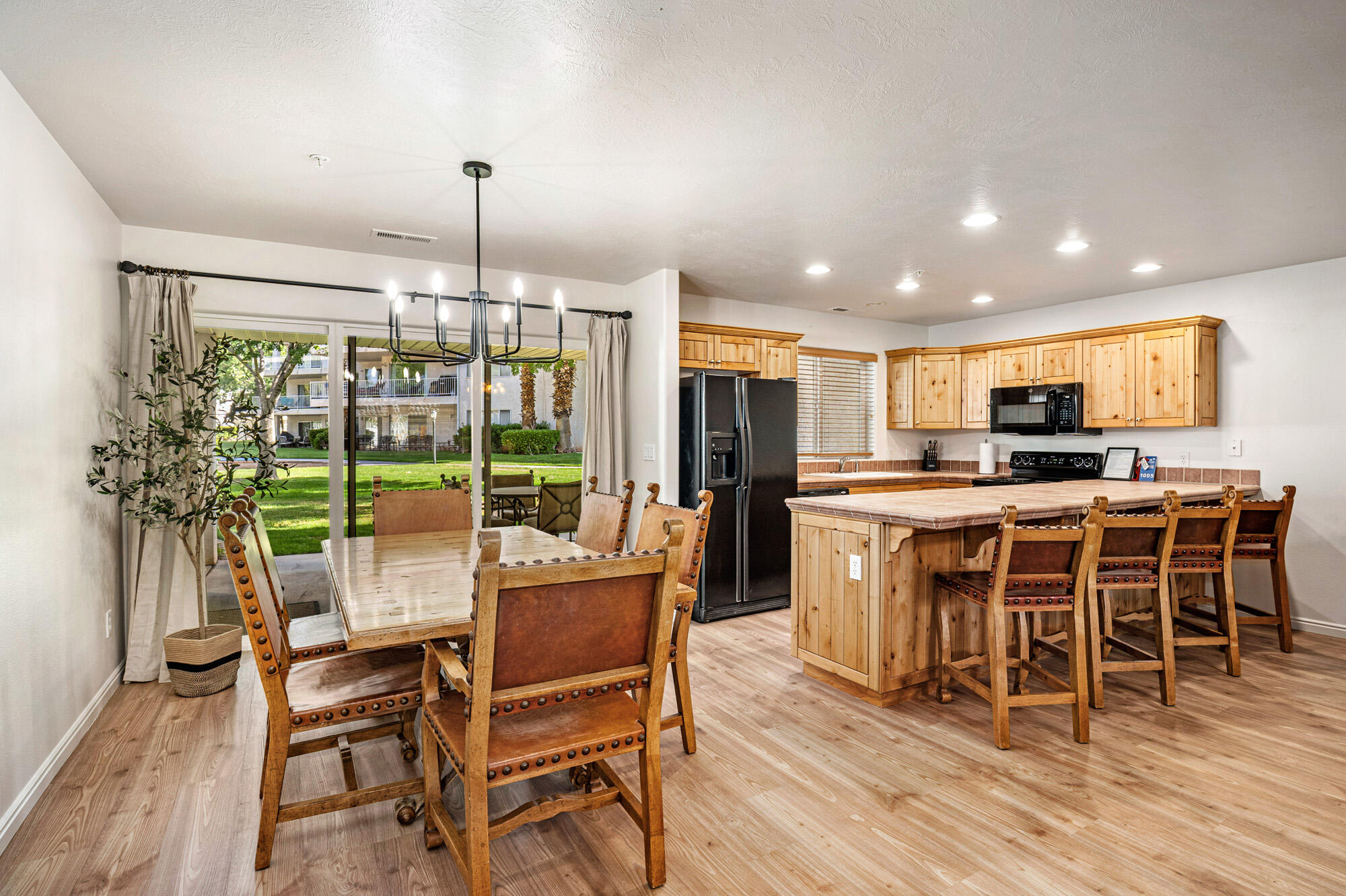 Just updated! Ground-floor Las Palmas Resort condo featuring an open-concept layout, New flooring, a gas fireplace, & a large breakfast bar. Enjoy a private covered patio with direct walk-out access to green space, pool area & a playground. Great  community amenities include six pools (with water slides & an indoor pool), hot tubs, pickleball, & a fitness center. Call agent for availability to show