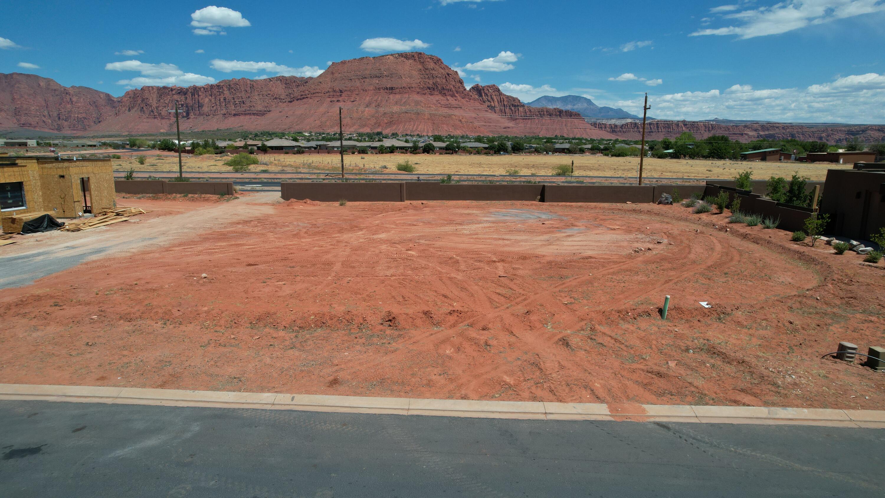 Build your dream home on this unobstructed view lot in the highly sought after Indigo Trails custom home community in Ivins.  There are only a hand full of lots remaining in this community and this one is ideal for those wanting an amazing mountain and valley view.   One of the adjacent lots is deeded no-build and has been professionally landscaped to provide a lush desert scape and further view protection.  Bring your own builder or use one of the pre-approved builders. All lot details are provided as a courtesy. Buyer and Buyers Agent to verify.