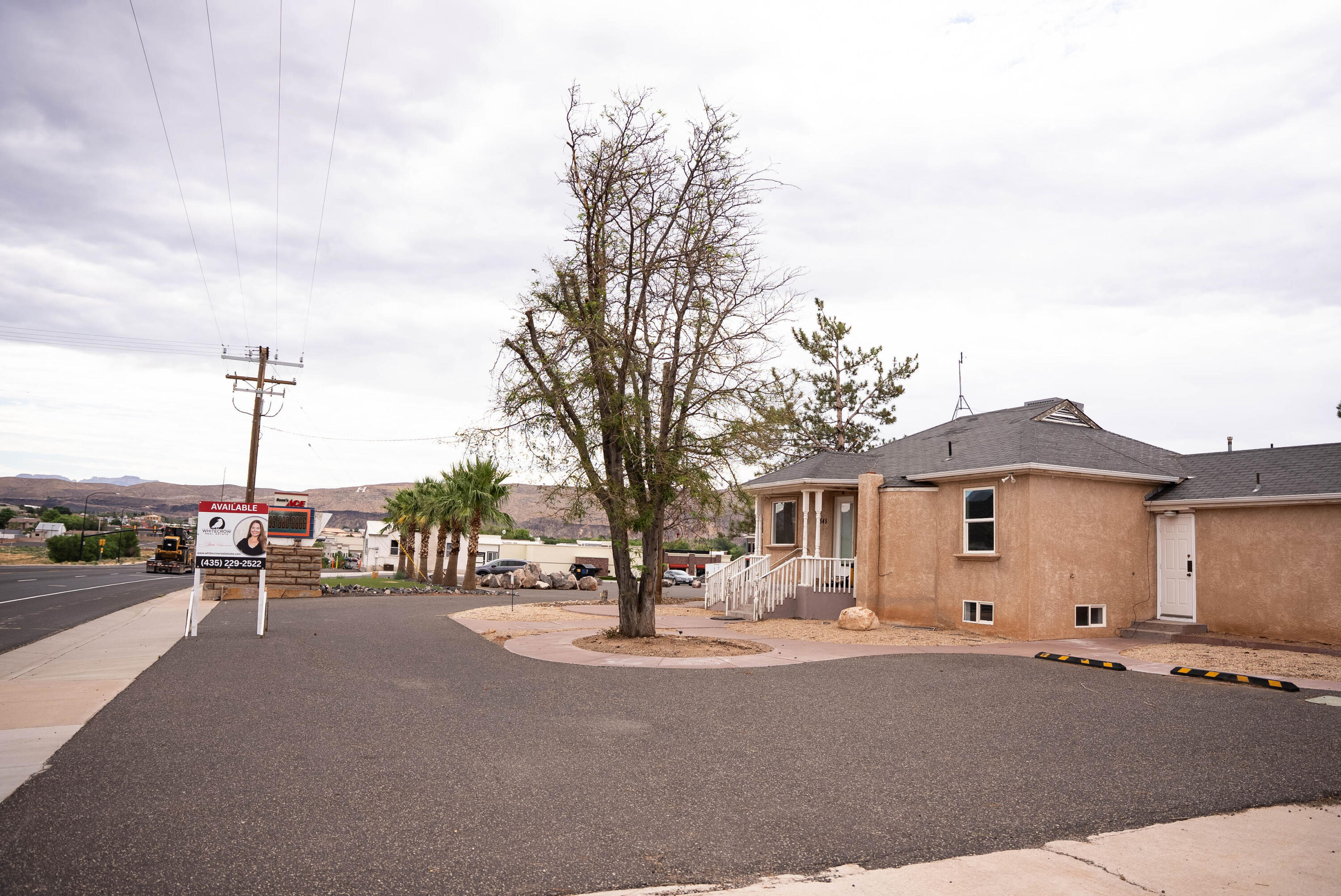 Commercial building with fenced yard and basement. Perfect for office or retail.