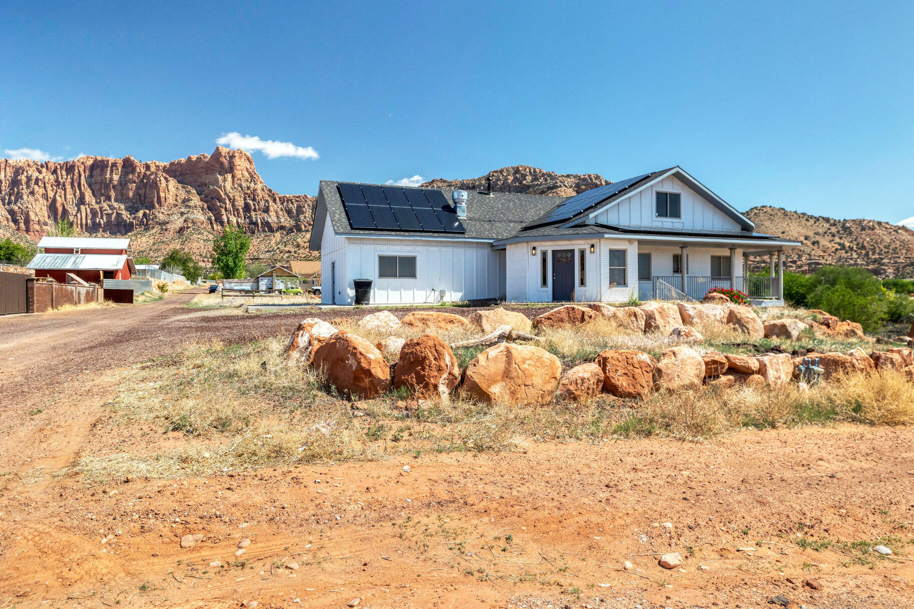 Discover a unique investment opportunity in the breathtaking red rock landscapes of Hildale, Utah--a community undergoing rapid revitalization and growth. Once a large single-family home, this spacious property has been thoughtfully re-zoned and remodeled into a legal multi-family residence. It now features two 3-bedroom, 2-bath units and a studio, 1-bath unit, each with its own entrance and rental potential. Whether you're seeking a steady income property, multi-generational housing, or a mix of both, this home offers flexibility, function, and opportunity. Hildale's rich history is evolving, and this property is perfectly positioned to be part of its next chapter. Solar Panels will be removed and are excluded from the sale.