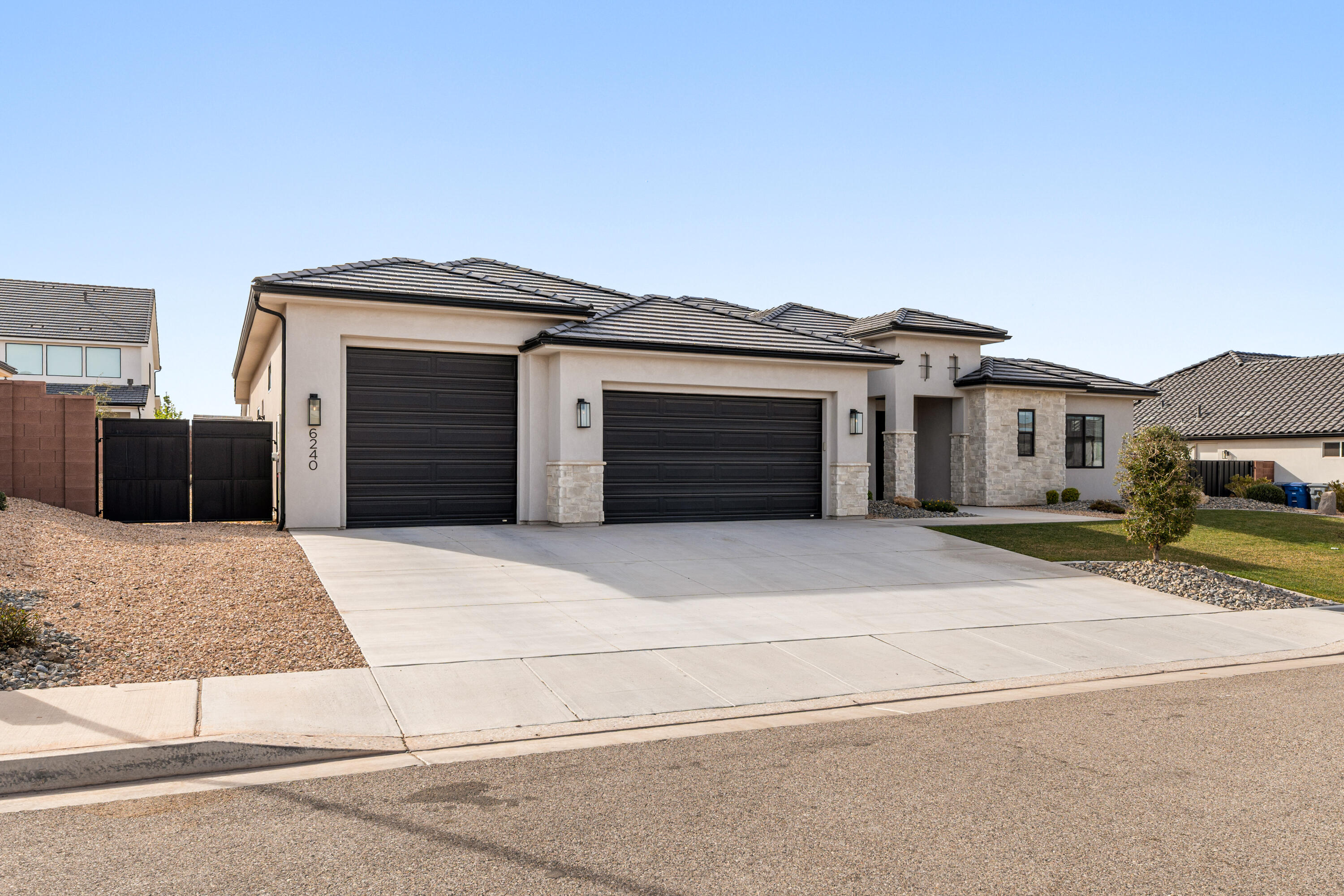 **Short sale NOT YET APPROVED by bank** Desert Living with Space for the Toys. Set in Desert Canyons near the Arizona line, this well-designed Jared West-built home combines open living spaces with thoughtful details throughout. Inside, 10-12 ft ceilings, 8 ft doors, and warm engineered hardwood floors create a bright, comfortable feel. The kitchen is built for both cooking and gathering, featuring stainless Bosch appliances, double ovens, quartz countertops, custom cabinetry, a large island, and a butler's pantry for extra storage and prep space. The great room stays light and welcoming with built-ins, a gas fireplace, and views into the landscaped backyard. A split floor plan adds privacy, while the oversized boat garage with epoxy floors offers plenty of room for vehicles, toys, and gear. Located just minutes from scenic hiking trails and outdoor recreation, this home delivers the space, comfort, and freedom that make Southern Utah living so appealing. No HOA.