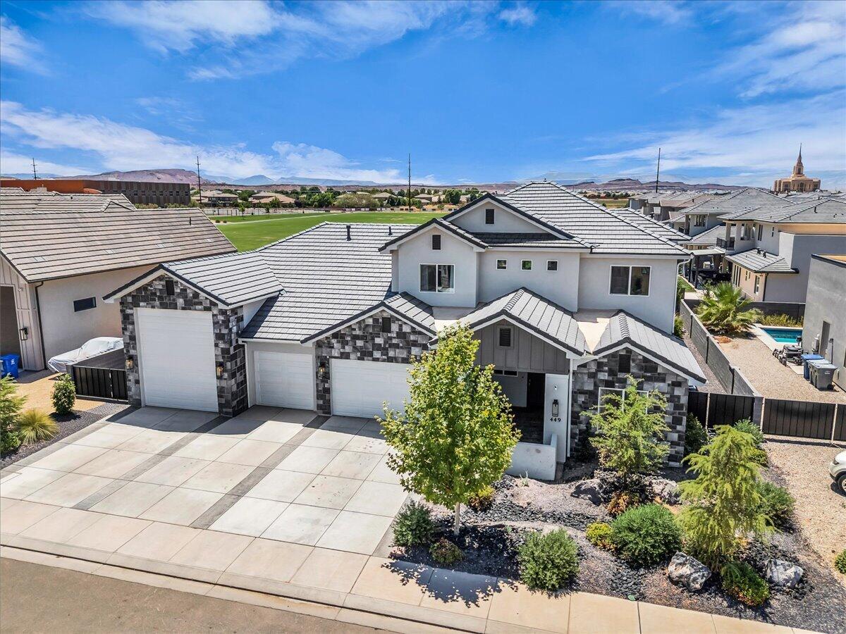 Experience modern luxury in this beautifully designed home featuring high-end finishes, an exceptional floor plan, and thoughtful upgrades throughout. The open-concept living space is filled with natural light and showcases a stunning gourmet kitchen with an oversized island, custom cabinetry, quartz countertops, stainless steel appliances, double ovens, a gas cooktop, and a spacious walk-in pantry. The inviting great room features a sleek fireplace with custom built-ins and seamlessly flows into the covered patio, creating the perfect space for indoor-outdoor living.

The spacious primary suite offers a spa-inspired bathroom complete with a freestanding soaking tub, oversized walk-in shower, dual vanities, and an expansive walk-in closet. Upstairs, you'll find a generous second family room that provides flexible space for a media room, playroom, or additional gathering area.

Outside, enjoy a fully landscaped backyard with room to relax, entertain, or play. Added privacy comes from the increased-height block wall, while metal gates on both sides of the home provide convenient access and functionality. The oversized RV garage offers ample space for recreational vehicles, boats, or extra storage. Conveniently located near parks, schools, shopping, and everyday amenities, this home offers the perfect combination of luxury, comfort, and practicality.