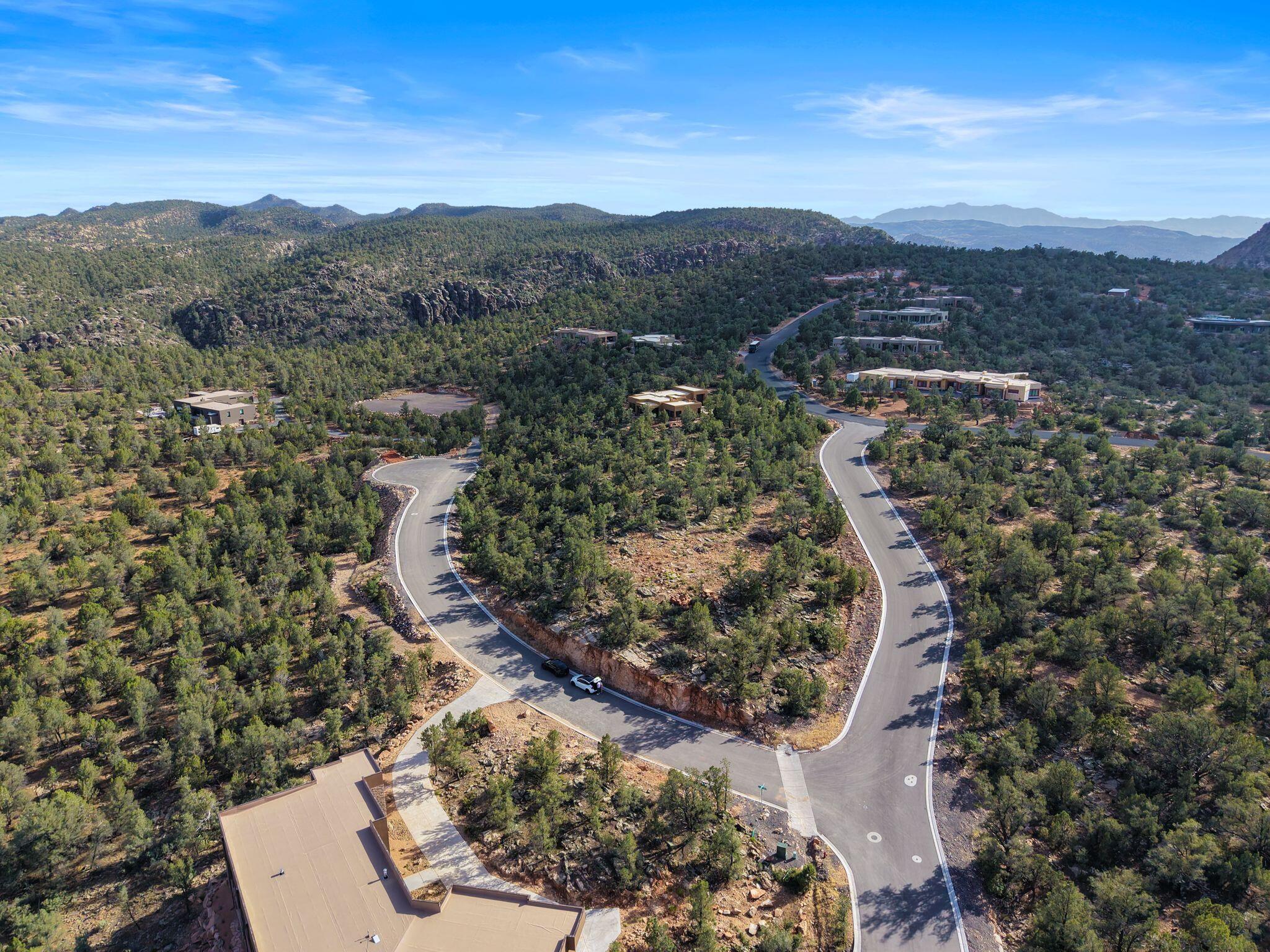 Tucked away in the scenic hills of Dammeron Valley, this elevated .93-acre homesite in Pinion Hills offers the perfect blend of privacy, natural beauty, and breathtaking views. Surrounded by mature trees and native landscape, this wooded lot captures sweeping views of the valley below while enjoying cooler temperatures than nearby St. George. Wake up to peaceful mornings, crisp mountain air, and the frequent sight of local wildlife including deer, quail, and other native birds roaming through the area. Whether you're looking to build a full-time residence or a quiet getaway, this rare property offers the serenity and scenery that make Dammeron Valley so special.