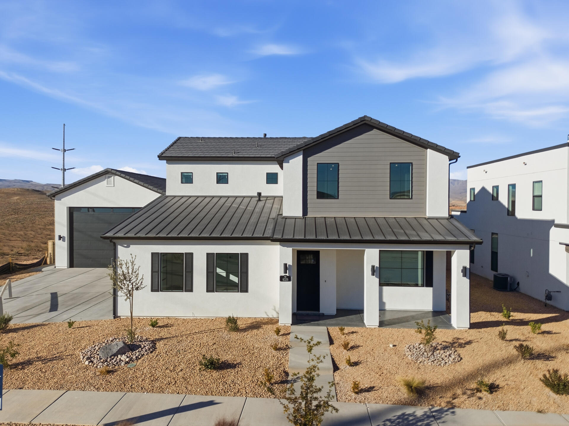 Don't miss out!! This home has been reduced. This beautiful newly completed 4 bed home features the Allegiant Balcony + Oversized RV Garage Floorplan and crafted by CareFree Homes - Southern Utah's trusted builder. CareFree delivers service that exceeds our home buyers expectations before, during and after the sale! Located in Desert Color with easy access to major highways and just minutes from exciting new commercial developments. This home is ideally situated for both work and play with amazing views and includes Quartz Countertops, 2x6 construction, 2'' faux wood blinds, epoxy garage floors, fully landscaped including turf, soft close drawers.