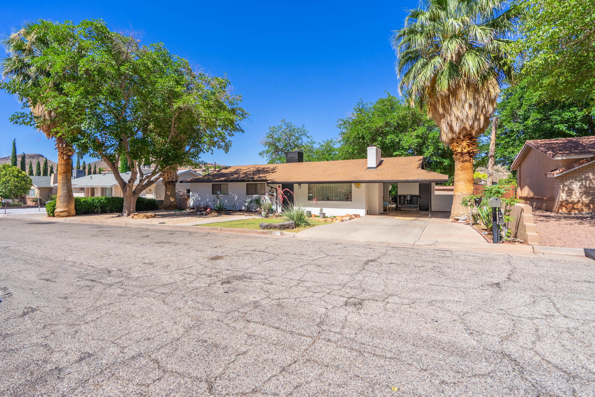 Welcome to this darling 3-bedroom, 2-bath home nestled in the highly desirable Red Hills neighborhood of St. George! Fresh new exterior paint enhances the home's curb appeal, while the spacious 0.25-acre lot, mature shade trees, and stunning Red Rock views create the perfect setting to call home. Best of all, there's no HOA!

Inside, you'll find a warm and inviting floor plan that's ready to make your own. Outside, the generous lot offers endless possibilities with room for entertaining, gardening, RV parking, or future expansion.

Location truly is everything! Enjoy the convenience of being within walking distance to historic downtown St. George, where you'll find local restaurants, boutique shopping, parks, community events, and year-round entertainment. This established, quiet neighborhood is known for its charm, mature landscaping, and unbeatable access to everything Southern Utah has to offer.

Whether you're searching for the perfect starter home, a second home, or an excellent investment property, this home checks all the boxes. St. George continues to be one of Utah's fastest-growing communities, offering over 300 days of sunshine each year, world-class golf, endless hiking and biking trails, nearby state and national parks, and a thriving economy. Don't miss this opportunity to own a beautifully maintained home in one of St. George's most sought-after neighborhoods!