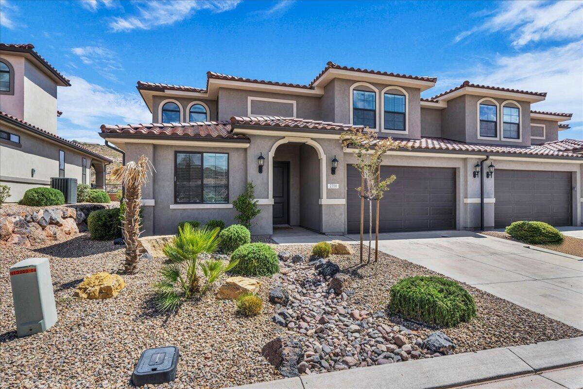 One of Washington County's most sought-after nightly rental communities, this turnkey home in the desirable Escondido community offers luxury living with excellent investment potential. Conveniently located near shopping, freeway access, and mountain biking trails, the community also features resort-style amenities including pickleball courts, a pool, hot tubs, and a lazy river. Ideally situated within the community, the home is next to a large short-term trailer parking area for trucks and trailers, while remaining just a short walk to the pool and clubhouse. Inside, the open-concept floor plan features 9-foot ceilings, large windows, abundant natural light, quartz countertops, alder soft-close cabinetry, premium tilework, and quality finishes throughout. The upstairs gaming loft provides additional gathering space, along with three bedrooms and two baths. The main level includes two bedrooms with private bathrooms, creating an ideal setup for family use or rental flexibility. The covered rear patio captures unobstructed mountain and desert views while offering added privacy rarely found in resort-style communities. Offered fully furnished, this well-maintained home is completely turnkey and ready for immediate enjoyment or continued short-term rental success. The garage has been upgraded with fresh paint and durable epoxy flooring, adding both style and function. Meticulously cared for and in like-new condition, this property combines comfort, convenience, and strong rental appeal.