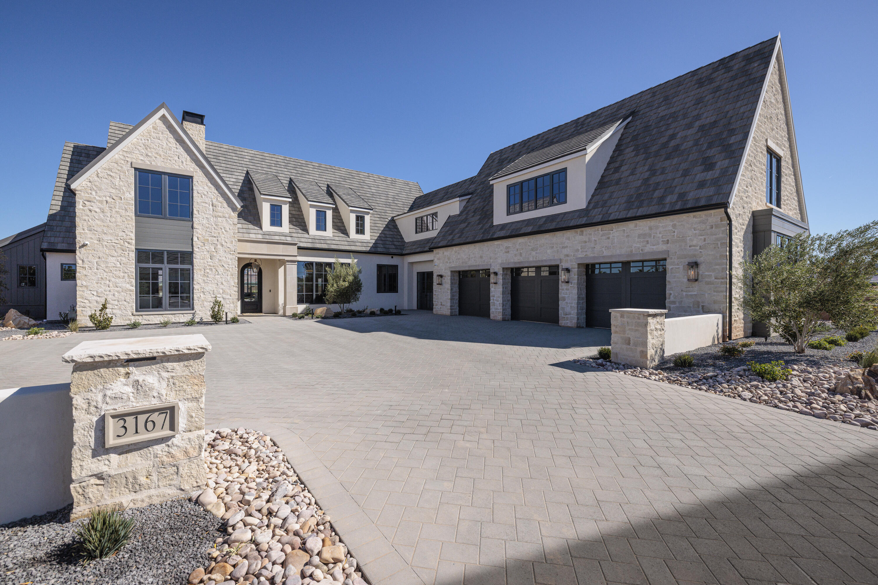 Designed and built by Christensen Homes, this new home offers an incredible floor plan highlighted by head-to-toe premium finishes and fixtures. Oversized windows flood this home with natural light and stunning views. The kitchen is equipped with Professional Wolf and Subzero appliances, natural Quartzite countertops, and designer fixtures, ready to host! Enjoy natural limestone, marble, plaster, and white oak finishes throughout. With 7074 square feet, 6 bedrooms, 7 bathrooms, multiple family/entertaining rooms, multiple laundry rooms, this home provides peaceful everyday living and effortless entertaining.