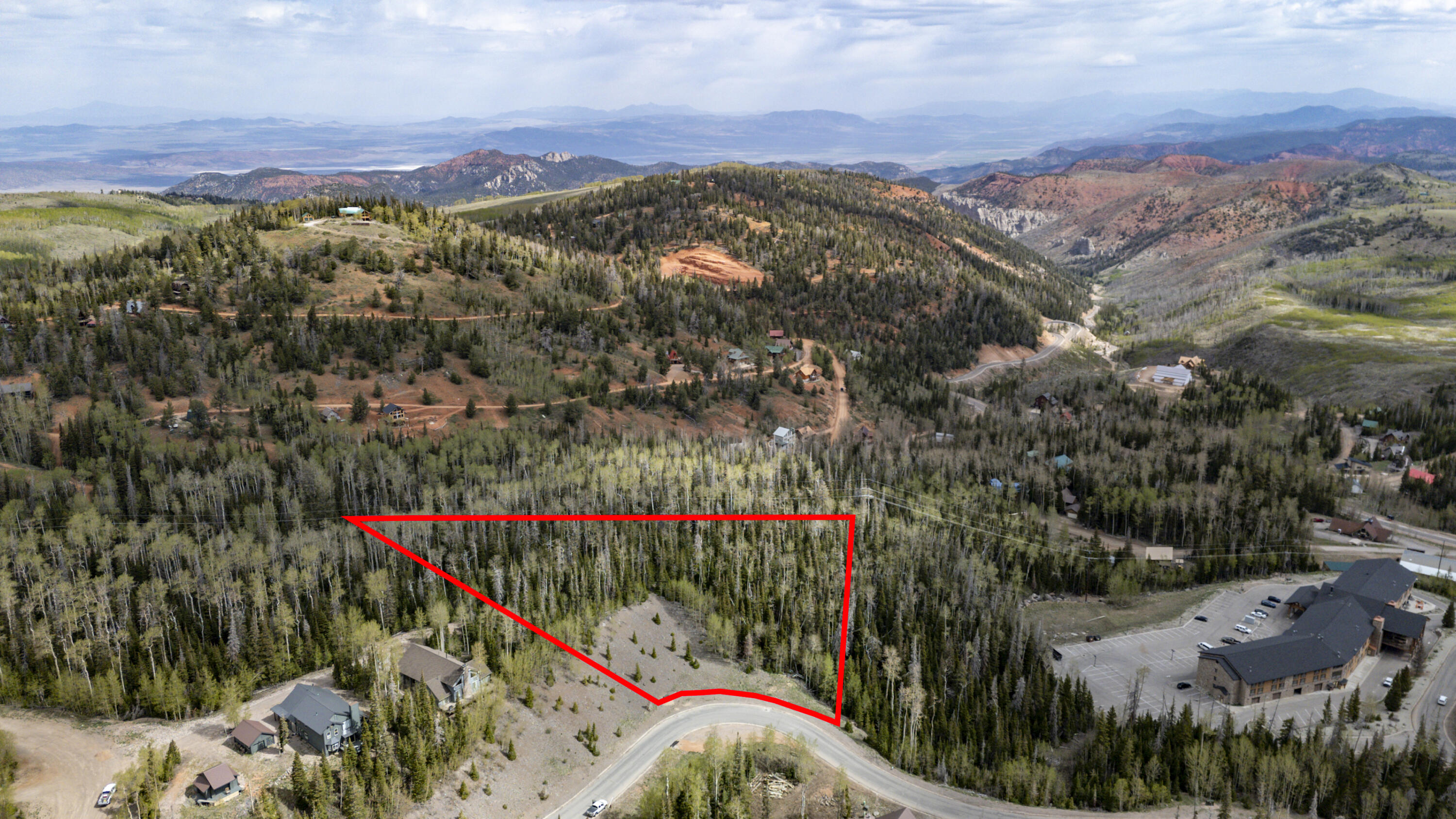 Discover a rare opportunity to own 4.81 acres of prime mountain property ideally located near Brian Head's hotels and the Navajo ski area. This expansive parcel offers the perfect
setting to create your private alpine retreat or explore subdivision potential. With convenient, year-round access from a paved road, the property combines accessibility with the serenity of mountain living. Enjoy stunning panoramic views and the peace of a natural setting, all while being surrounded by established million-dollar homes. Utilities are available at the street, making development even more seamless. Whether you're looking to build a dream getaway or invest in a growing mountain destination, this property delivers exceptional potential.