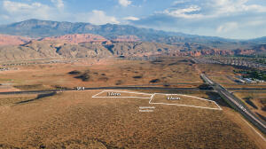 This is an incredible opportunity to own up to 9.26 acres (adjacent 6.26 acres for sale also) right at the junction of SR7 and SR9 right at the corner of the interchange! These parcels sit right in the path that millions of visitors use to visit Zion National Park and all of the surrounding recreational activities in the area. Massive development is already underway in this popular vacation spot, including the new Jellystone Park™ Zion, UT.  Jellystone is a brand new water park and campground located on Sand Hollow Rd on the way to Sand Hollow Reservoir.

Sand Hollow State Park is also just minutes up the road and is an adventure oasis featuring a 1,322-acre reservoir and an extensive off -highway vehicle recreation area on Sand Mountain. Hugely popular with outdoor enthusiasts, Sand Hollow draws thousands of visitors each year.  

Walmart is towards the west and in close proximity to the parcels. Downtown Hurricane with plenty of restaurants and shopping is just to the east. These parcels are in a prime location where much development is in the works. 

This gateway area is the up-and-coming new Southern Utah destination area that will be a major economic hub for Hurricane and the surrounding area.
The proximity of the airport (which can be accessed on SR7), St. George, Mesquite, Las Vegas, SLC etc. make this a prime investment opportunity.  
Construction has begun on the new frontage road that will service this parcel. The roundabout off Sand Hollow Rd. (3700W) has been started and the road is heading east and this phase will end at this parcel. See new pics! 
Hwy Commercial zoning allows for Hotels, RV Parks, restaurants,  and many other tourist related opportunities. The utilities and frontage road improvements which will service these parcels have received city approvals and are in the works through the Gateway PID.
