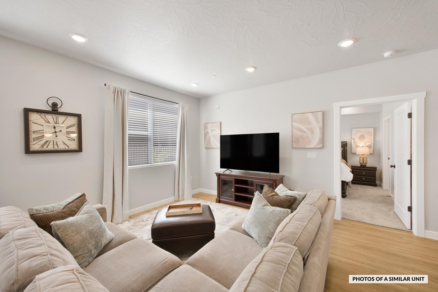 Fully furnished, ground level, ready to book as an STR! This ADA-compliant condo sits in the best spot in the complex, with the pool, lazy river, hot tub, and outdoor kitchen with BBQs all just steps from the door. A neighboring unit is also available for purchase, giving you the option to list both as a combined property on Airbnb for larger groups and stronger nightly returns. Inside, the open-concept layout is designed for connection. The designer kitchen offers stainless appliances and a crisp, contemporary feel, with LVP flooring and recessed lighting throughout the home. Premium furnishings include high quality mattresses, plates, pots, pans, and smaller essentials the builder's package leaves out, making this a truly turnkey unit with nothing left to source. Three bright bedrooms include two with an en-suite bath. Owners have the flexibility to self-manage or partner with any property management company they choose. Purchase also gives access to the Coral Springs condominium amenities, which include a fitness center, indoor pool, basketball court, and tennis courts. The new Rush Funplex amusement center has recently opened to draw demand to the area. All the setup work is done, just list and start booking!