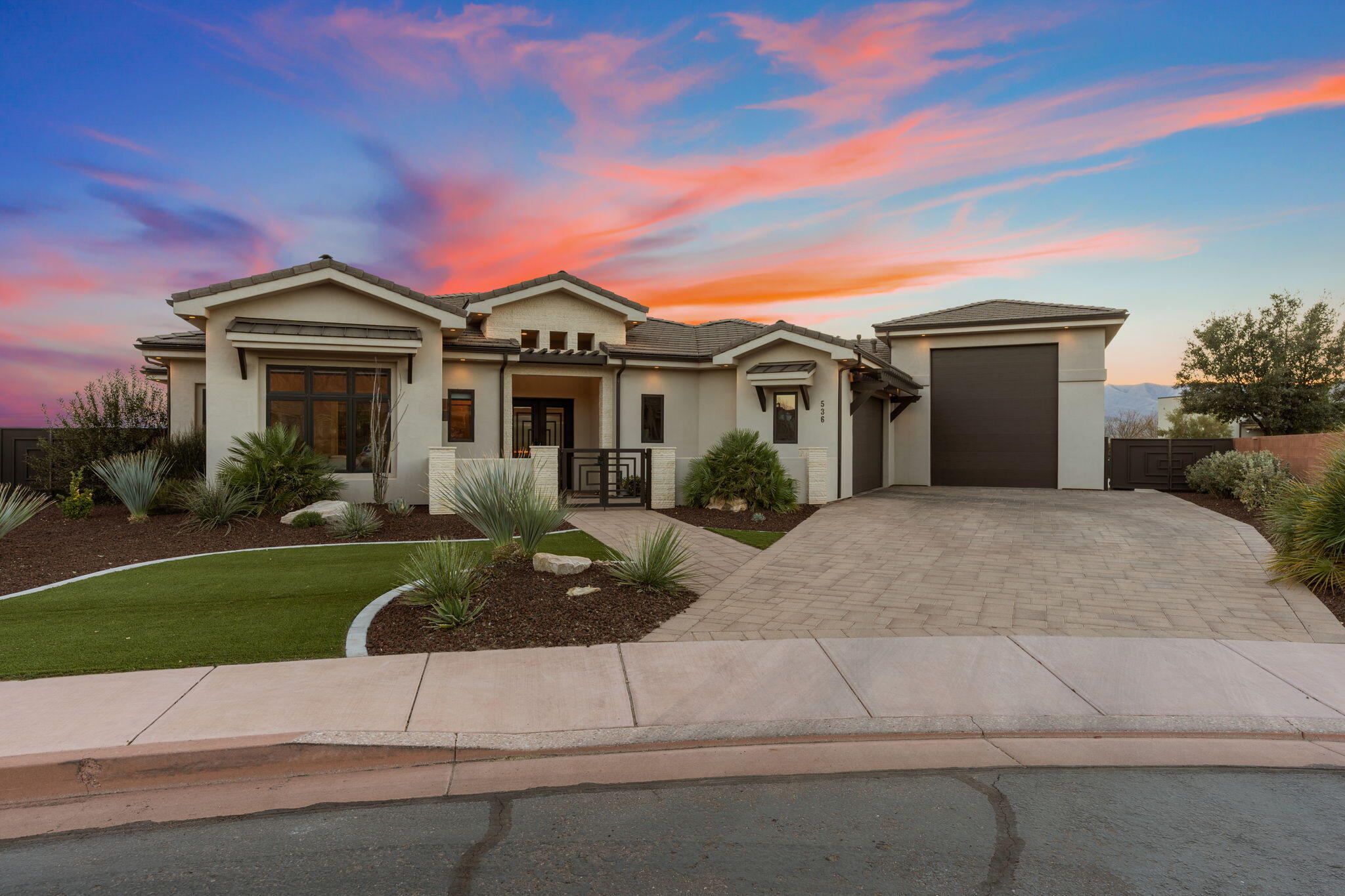 Parade Home Quality that Won't Break the Bank! Experience luxury living in a home designed to be truly enjoyed, complete with breathtaking red rock views. This 4-bedroom, 3-bath home offers thoughtfully designed spaces that flow effortlessly—from the guest rooms to a private office and cozy breakfast nook, and into the chef's kitchen with a second prep kitchen and butler's pantry—perfect for quiet mornings or hosting friends and family. A full expansive slider door off the living room and a retractable slider window off the kitchen blur the line between indoors and out, creating an ideal setting for relaxed evenings or lively gatherings. With soaring 20' ceilings accented by wood beams and a floor-to-ceiling custom rock fireplace, this home is truly stunning.
