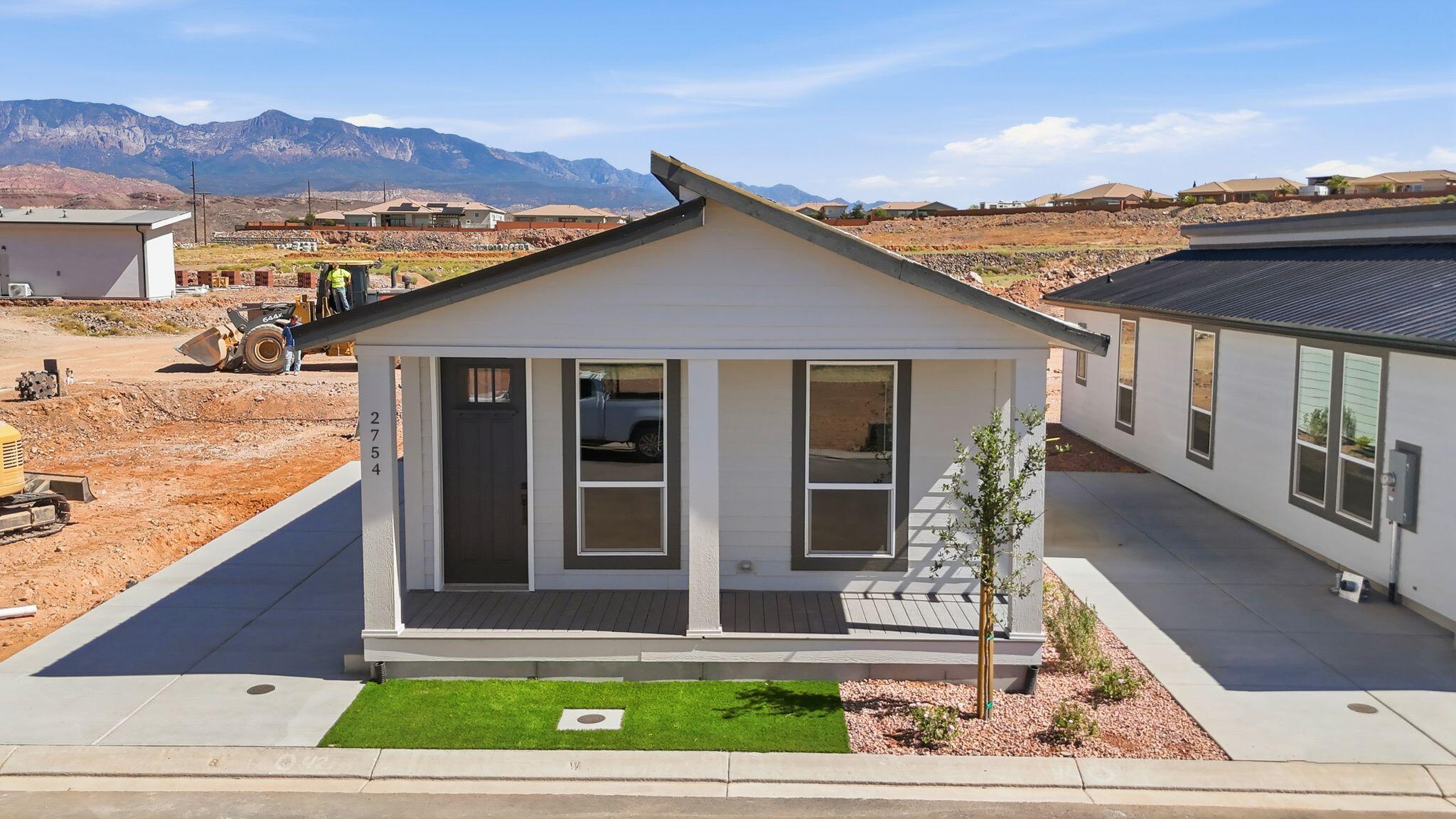 Move-in ready now at Canyon Villas! This brand-new 1,100 sq ft single-family CrossMod home offers 3 bedrooms and 2 bathrooms with neutral-toned cabinetry throughout, creating a warm, light-filled feel. Enjoy your own private yard and private driveway with zero shared walls -- true single-family living. Community fee includes the pool, hot tub, clubhouse, playground, pickleball court, pavilion, and dog park, plus  includes water, fiber internet service, and yard maintenance -- an all-inclusive lifestyle similar to condo ownership, but with a yard and driveway all your own. Ask about financing options that may reduce your monthly out-of-pocket cost, and about current buyer incentives.