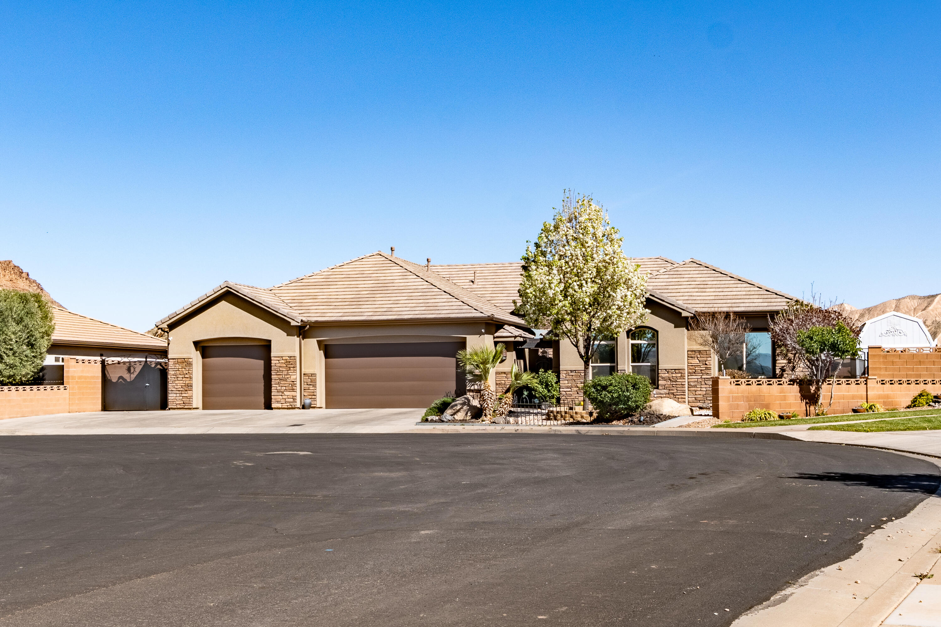 Beautifully upgraded home where luxury, comfort, and thoughtful design come together seamlessly. This exceptional 5-bedroom, 3.5-bath home with a 3-car garage offers an elevated lifestyle with high-end finishes and intentional functionality throughout. From the moment you arrive, you're welcomed by elegant curb appeal featuring low-maintenance zero landscaping,  a custom shade awning at the front entry into a courtyard and a charming raised rose garden. Inside, the home has been freshly painted and enhanced with rich new wood flooring that flows throughout, creating a warm and sophisticated ambiance. Designed for modern living, the home features zoned air and heating for personalized comfort, HDMI integration in the living room for a clean entertainment setup, and an expansive primary suite with an extra-large custom closet. A private casita with a separate entrance provides flexibility for guests, extended family, or rental potential, while a huge storage room ensures ample space for organization. Step outside to your own resort-style retreat, complete with a custom saline pool and spa with an electric cover. A truly unique feature is the man-made sandy beach with seashell accents and a cozy fire pit, creating a one-of-a-kind outdoor experience. The backyard also includes colored stamped concrete, a French drain system, and a fully equipped BBQ kitchen under a stylish awning. An outdoor hut has been reinforced to accommodate a mounted TV, perfect for entertaining. This home is fully wheelchair accessible, featuring 36-inch wide doorways and closets, level flooring throughout with no step-ups, and a primary bathroom with a wide, accessible shower.

A rare blend of luxury, accessibility, and exceptional design, this home offers a truly distinctive living experience.