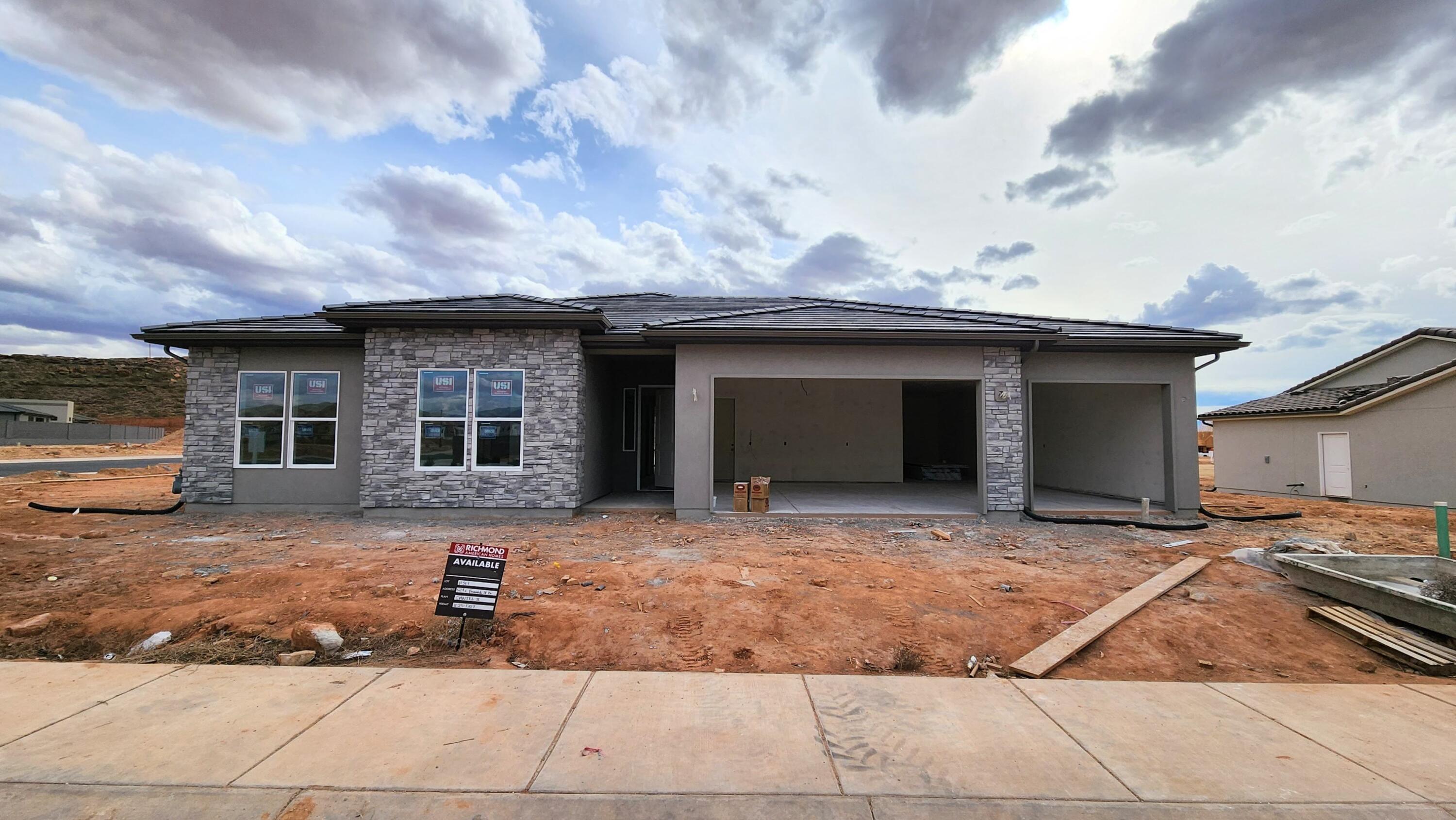 NEW Construction in sought-after area near Crimson Cliffs High School! Builder is offering special financing with their preferred lender! The ranch-style Daniel II plan greets guests with a charming covered entry. Inside, you'll find a spacious great room and gourmet kitchen, complete with built-in oven and microwave, center island, and extended dining area/ sunroom. An elegant primary suite featuring an immense walk-in closet and attached bath is separated from three additional bedrooms for privacy. This home also features a covered patio and spacious 4-car tandem garage. Buyer to verify all info.