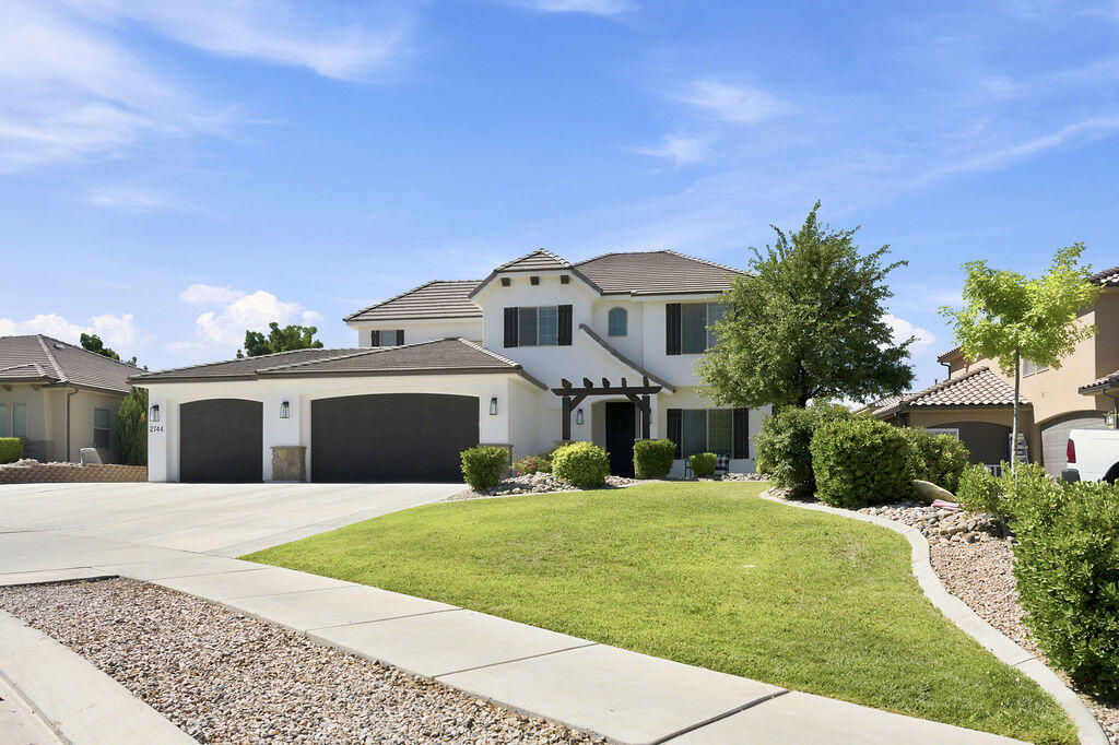 This is the home you have been waiting for, freshly renovated and located in one of St. George's most highly sought after neighborhoods with no HOA. The main floor features an open layout with primary suite conveniently located on main floor, bright and airy kitchen with custom cabinetry and living room with cozy fireplace. Come see this rare find with a deep third car garage plus side yard parking, ideal for RV, boat or extra vehicles. Situated across the street from the neighborhood park and a short drive to recreational trails.