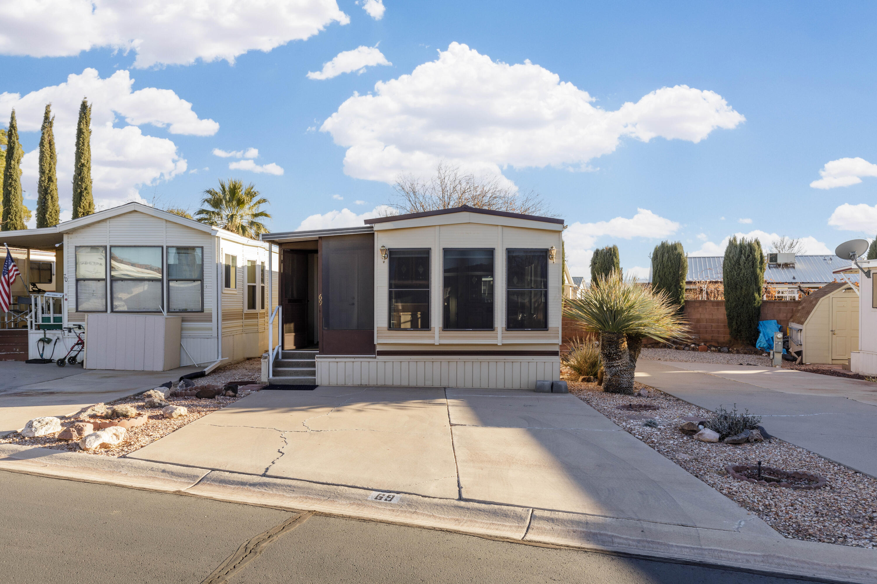 Dixie Downs is the ultimate 55+ community!  This park model is lovingly kept up.  The addition of the den/bedroom and laundry room makes it very spacious.  A simple install of a door would make this a two bedroom unit. Roof is only 3 years old and the power pedestal is 4 years old. This unit includes solar shades to keep it cool.  Washer, dryer and refrigerator are all included.  There is an ample storage shed that is wired with power and light in the back.  The low HOA fee of $85 p/m give you access to pool, hot tub, clubhouse and more.  The community is very active with many activities throughout the year.  A perfect place to spend your retirement years!