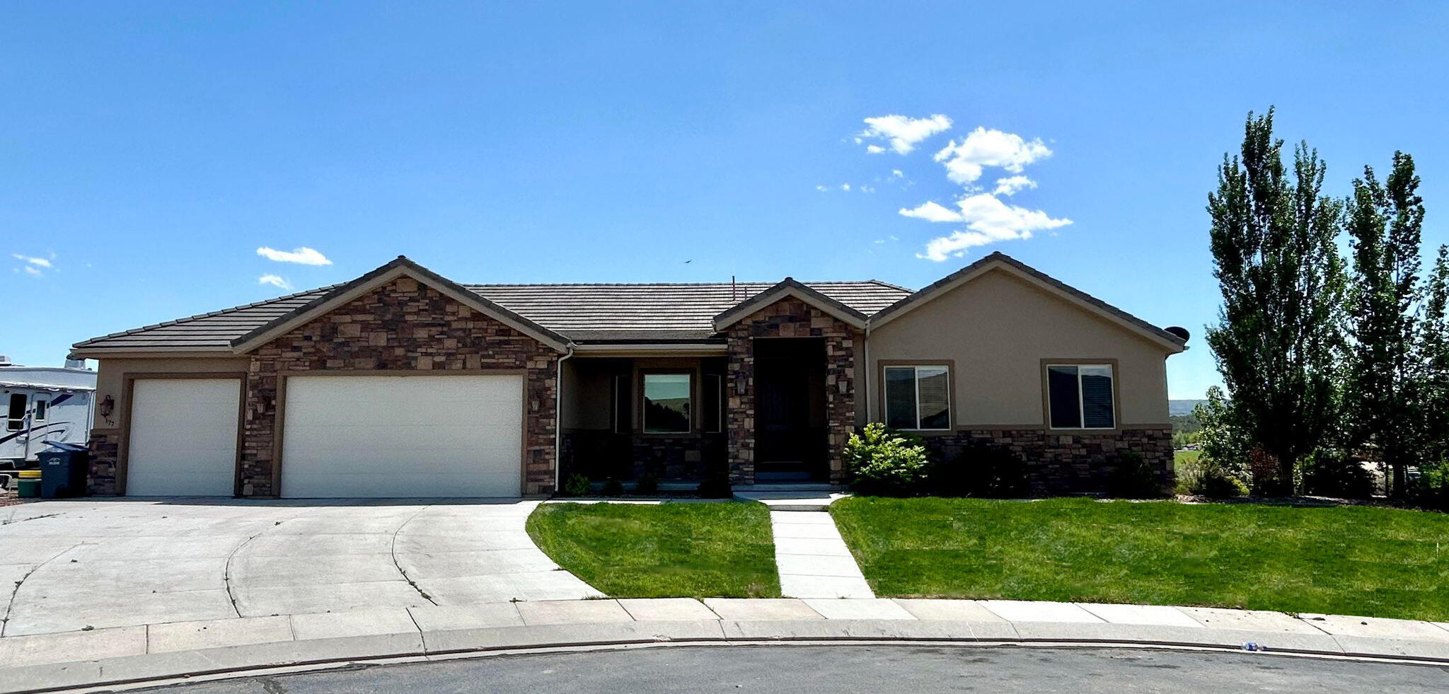 This 6 bedroom, 4 bath literally has everything one could ever need. On more than half an acre, It sits on one of the most prime pieces of land with an amazing view of the entire valley. Each bedroom is impressive in size and has custom built ins in the closets. This home has central vac throughout, large spaces for gathering, high ceiling heights, two laundry rooms, a home office, guest suite with private bathroom and entrance, theater room, and cold storage, plenty of extra storage throughout, enormous walk in pantry, two fireplaces including a stove burning and insert, large four car garage, RV parking on the side of home, front and back yard landscaping with automatic sprinklers, deck and covered patio, and so much more.