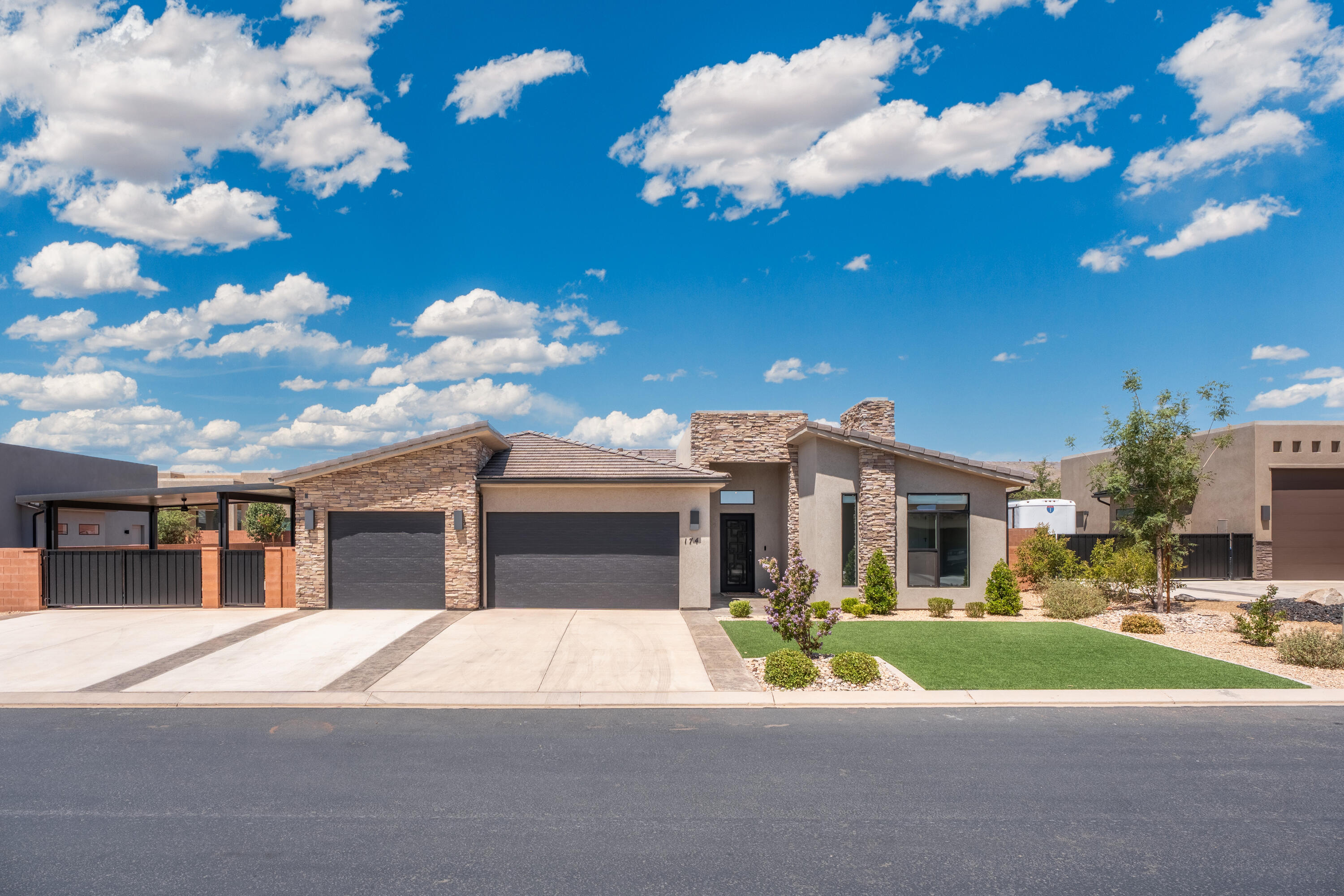 Thoughtfully upgraded and beautifully maintained, this home in desirable Anasazi Vista combines quality finishes, functional living spaces, and an unbeatable location. Featuring 4 bedrooms, 3 bathrooms, and a beautifully remodeled casita with its own private living room, this home provides the flexibility you've been looking for, whether it's for guests, extended family, or a private workspace. The gourmet kitchen is the heart of the home, featuring granite countertops, warm knotty alder cabinetry, premium Café appliances, a gas range, and a hidden walk in pantry. The open floor plan flows seamlessly into the spacious living room, where a cozy gas fireplace creates the perfect place to gather with family and friends. The spacious primary suite offers a peaceful retreat with a walk-in shower with tub, dual vanities, and a large walk-in closet. Two laundry rooms add everyday convenience, while the private patio is the perfect place to enjoy your morning coffee or relax at the end of the day. Covered RV parking provides extra room for all your toys or the perfect sunshade for your outdoor adventures. Thoughtful improvements, including new landscaping with turf, concrete pads, pathways, and an in-ground trampoline, a remodeled casita that expands the living space, a custom shade structure, automated roller blinds, custom organization systems, and a water softener. Ideally located just minutes from Snow Canyon State Park, Fire Lake Park, Tuacahn Amphitheatre, Gunlock Reservoir, schools, restaurants, shopping, and endless hiking and biking trails, this home offers the perfect opportunity to enjoy the Southern Utah lifestyle while surrounded by some of the area's most breathtaking scenery.