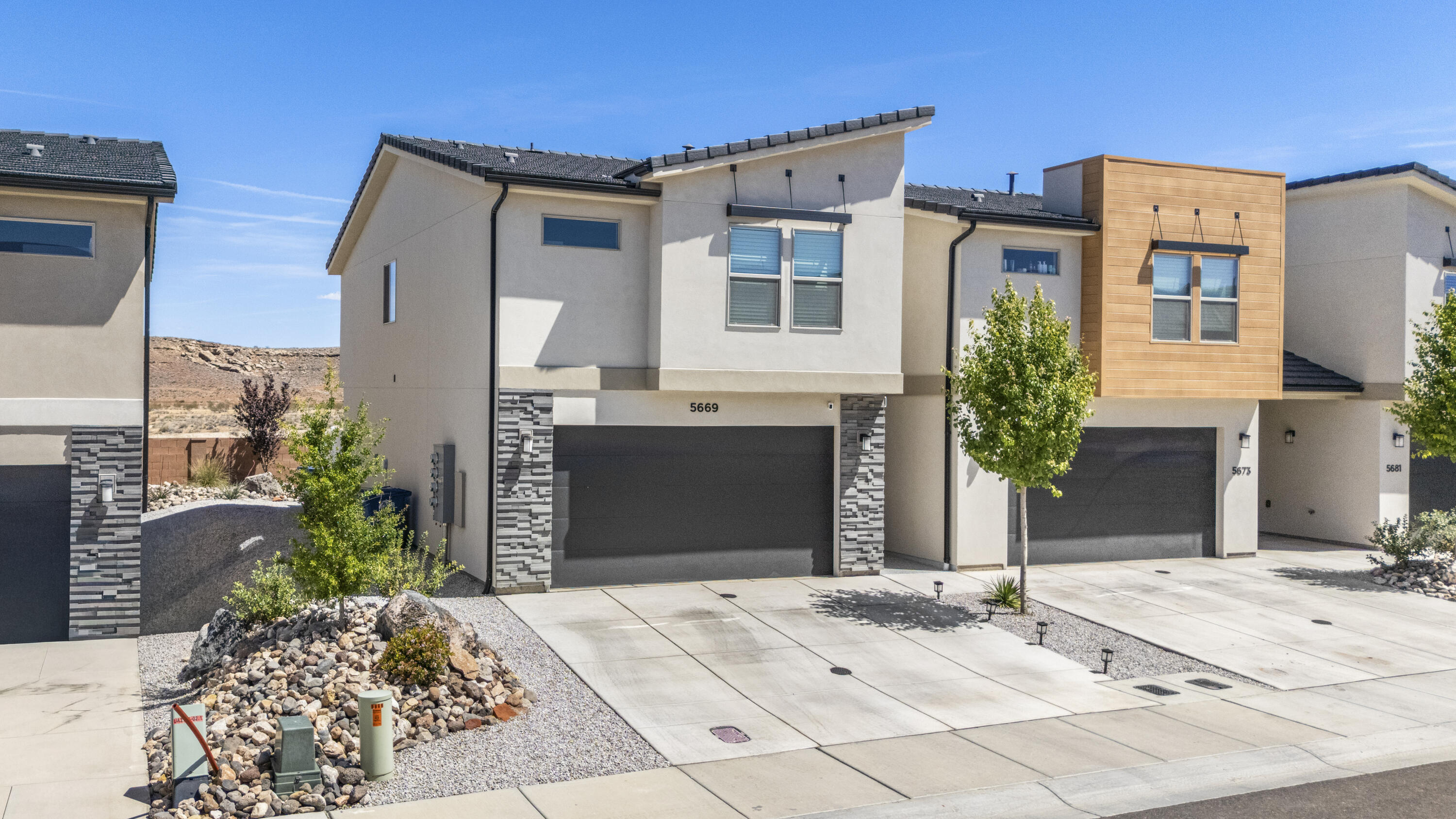 4 bed, 2.5 bath end-unit townhome with a 2-car garage in the newer South Desert community. This like-new home is filled with natural light and features EVP flooring in the main living areas and bathrooms, upgraded carpet in bedrooms, quartz countertops, stainless steel gas appliances, modern cabinetry, and a clean tile backsplash. The kitchen is built for function with a large island that flows right into the open living space, making it easy for everyday living or hosting. Custom accent walls add a modern touch without overdoing it. End unit provides extra privacy along with a private, fenced backyard that works well for relaxing, pets, or play. Located near parks, walking trails, shopping, dining, and main road access, this is a clean, low-maintenance option that's move-in ready and easy to own.