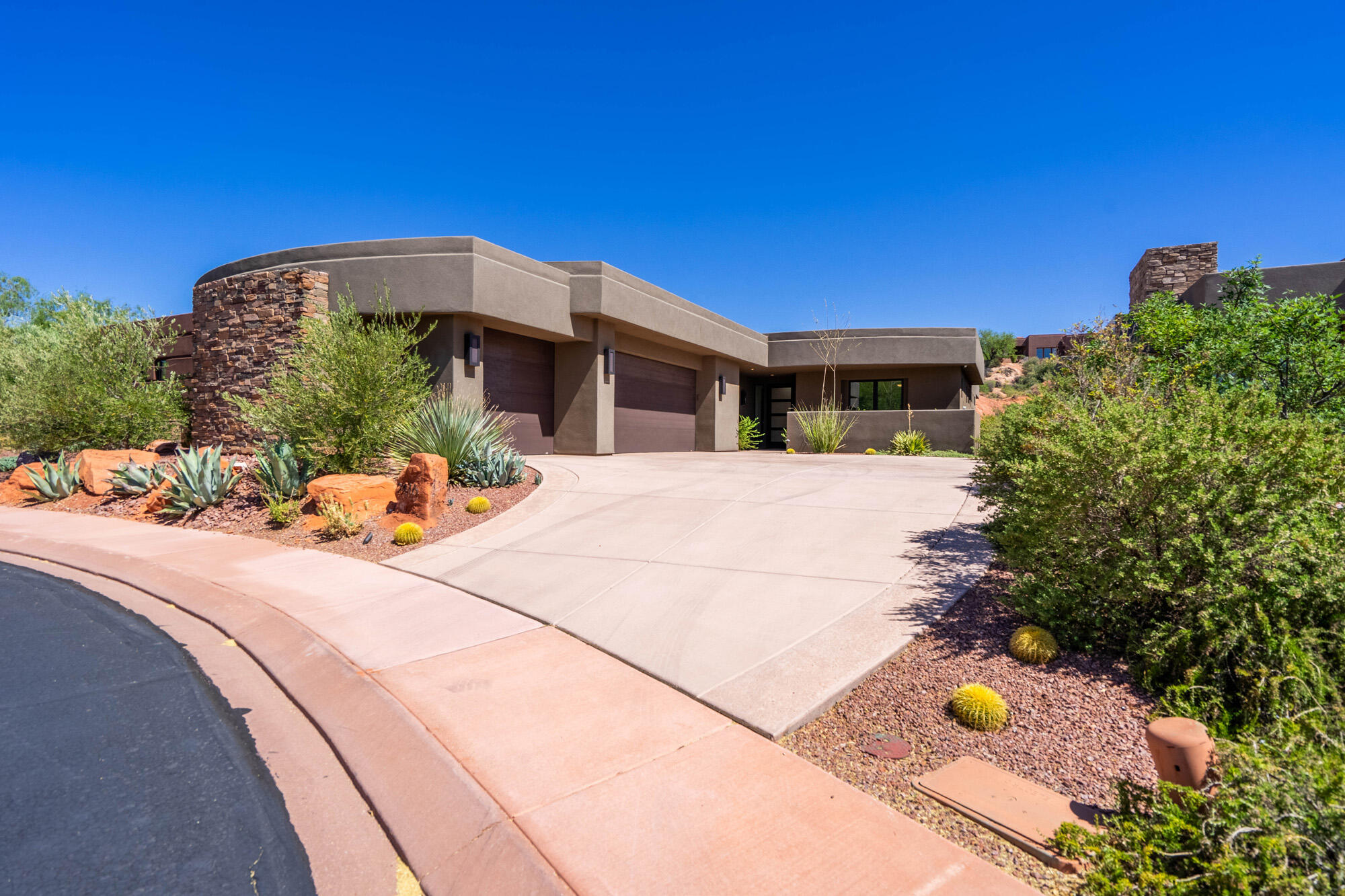 Experience the best of Entrada living in this beautifully designed home with stunning Red Mountain views and exceptional indoor-outdoor living. Built by highly respected local builder Brian Geer, this home showcases the quality craftsmanship, thoughtful design, and attention to detail that his homes are known for.

The open, inviting floor plan is perfect for both everyday living and entertaining. The gourmet kitchen is a dream for any chef, featuring premium Wolf and Sub-Zero appliances, custom cabinetry, and elegant finishes throughout.

The spacious primary suite offers a private retreat with a cozy fireplace, spa-inspired bathroom, and generous walk-in closet. Hardwood floors, custom lighting, and upscale finishes create a warm and sophisticated atmosphere throughout the home.

Step outside to your private outdoor oasis complete with a covered patio, built-in grill, oversized fire pit, and breathtaking views of the surrounding red rock landscape. Whether enjoying a quiet morning coffee or hosting friends under the stars, this space was designed to be enjoyed year-round.

Additional features include an oversized 3-car garage and access to Entrada's world-class amenities. Located just minutes from Snow Canyon State Park, hiking and biking trails, golf, dining, and all that Southern Utah has to offer, this home combines luxury, comfort, and adventure in one exceptional package.

Come experience the craftsmanship, views, and lifestyle that make this Entrada home truly special.