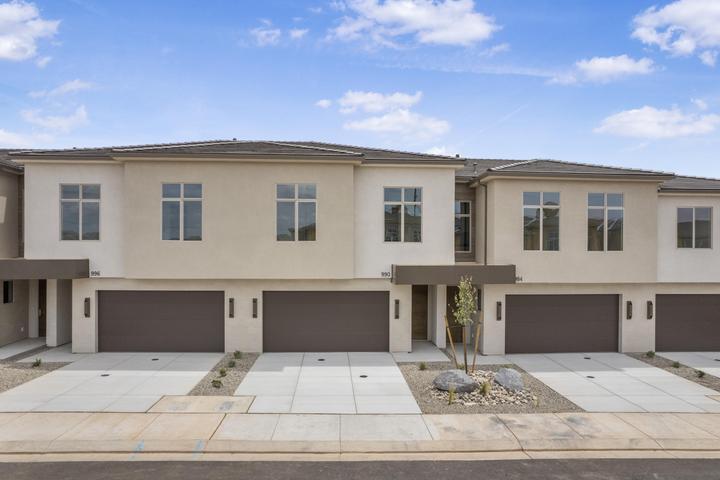 Experience the perfect blend of luxury, comfort, and carefree living in this spacious 4-bedroom high-end townhome. Whether you're searching for an affordable second home, vacation retreat, or the ideal primary residence, this exceptional property offers the upscale finishes and refined lifestyle typically found in a million-dollar home -- without the million-dollar price tag. Designed with both elegance and functionality in mind, this stunning home features soaring ceilings, oversized windows that fill the space with natural light, impressive 8-foot doors, designer finishes, custom details, and top-of-the-line appliances throughout. Every space has been thoughtfully crafted to create a sophisticated yet comfortable atmosphere perfect for everyday living or relaxing getaways. Ideal for those looking to downsize without sacrificing quality, style, or luxury, this townhome offers the convenience of low-maintenance, lock-and-leave living. Enjoy beautifully maintained landscaping, resort-style amenities, and an elevated lifestyle -- all without the work of upkeep and exterior maintenance. From the spacious open-concept living areas to the incredible community amenities, this is the perfect opportunity to enjoy luxury living, effortless convenience, and the lifestyle you deserve. These photos are of a 4 bedroom unit in this building and may or may not be the actual unit addresses above.