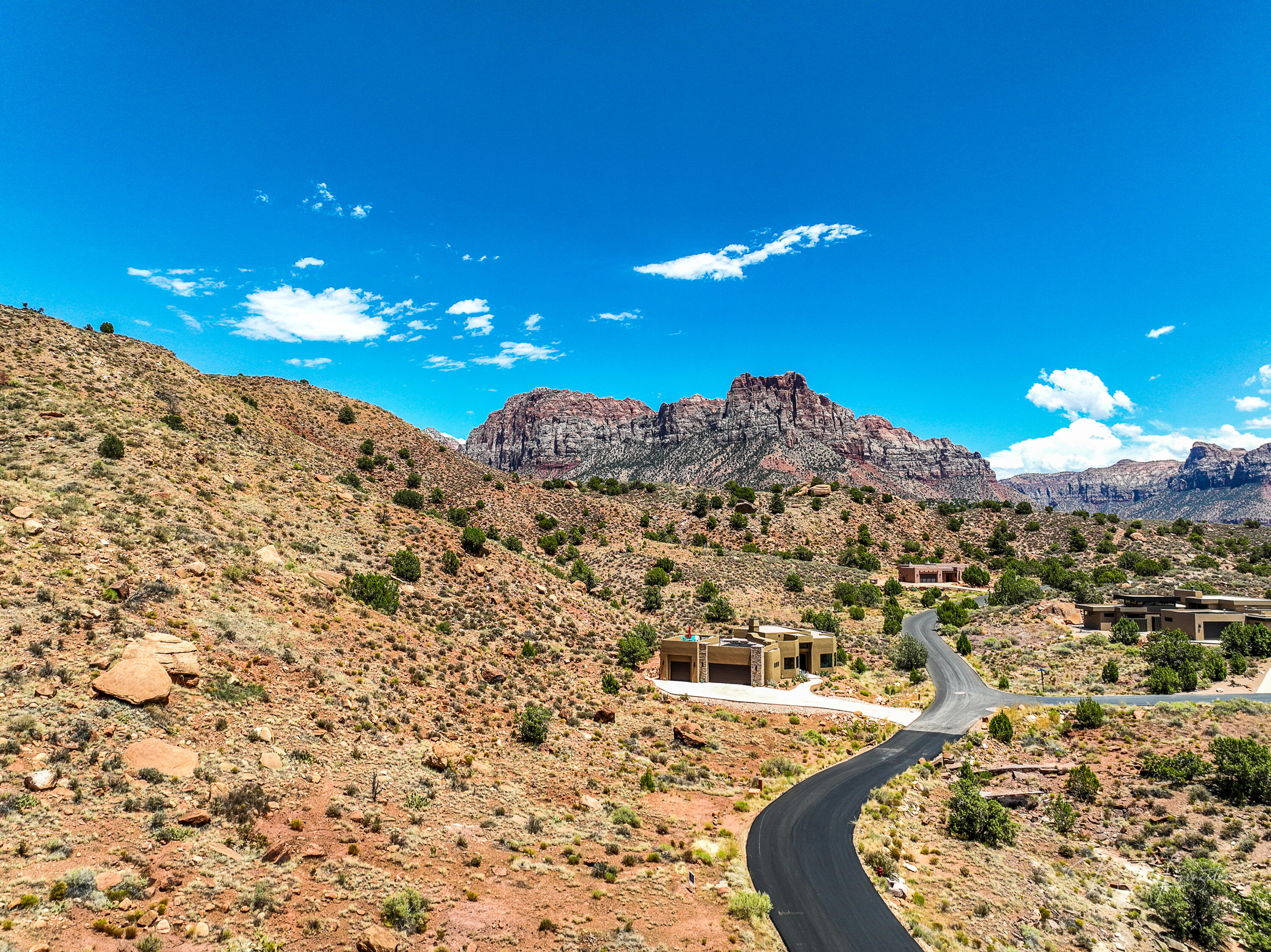 Welcome to beautiful Anasazi Plateau subdivision that consists of approx 300 acres and unbeatable views of Zion National Park.  This buildable lot is 1/2 acre with quick access to one of nature's most scenic areas in Southern Utah. Natural conservation land surrounds the 1/2 acre property so neighbors are a distance away. Utilities to lot line and access to fiber optic make this the perfect serene building location!  Sellers have saved buyers thousands of dollars by doing the soils and engineering study already.  Ready to build your dream home! Lot lines drawn in pictures are approximate only.