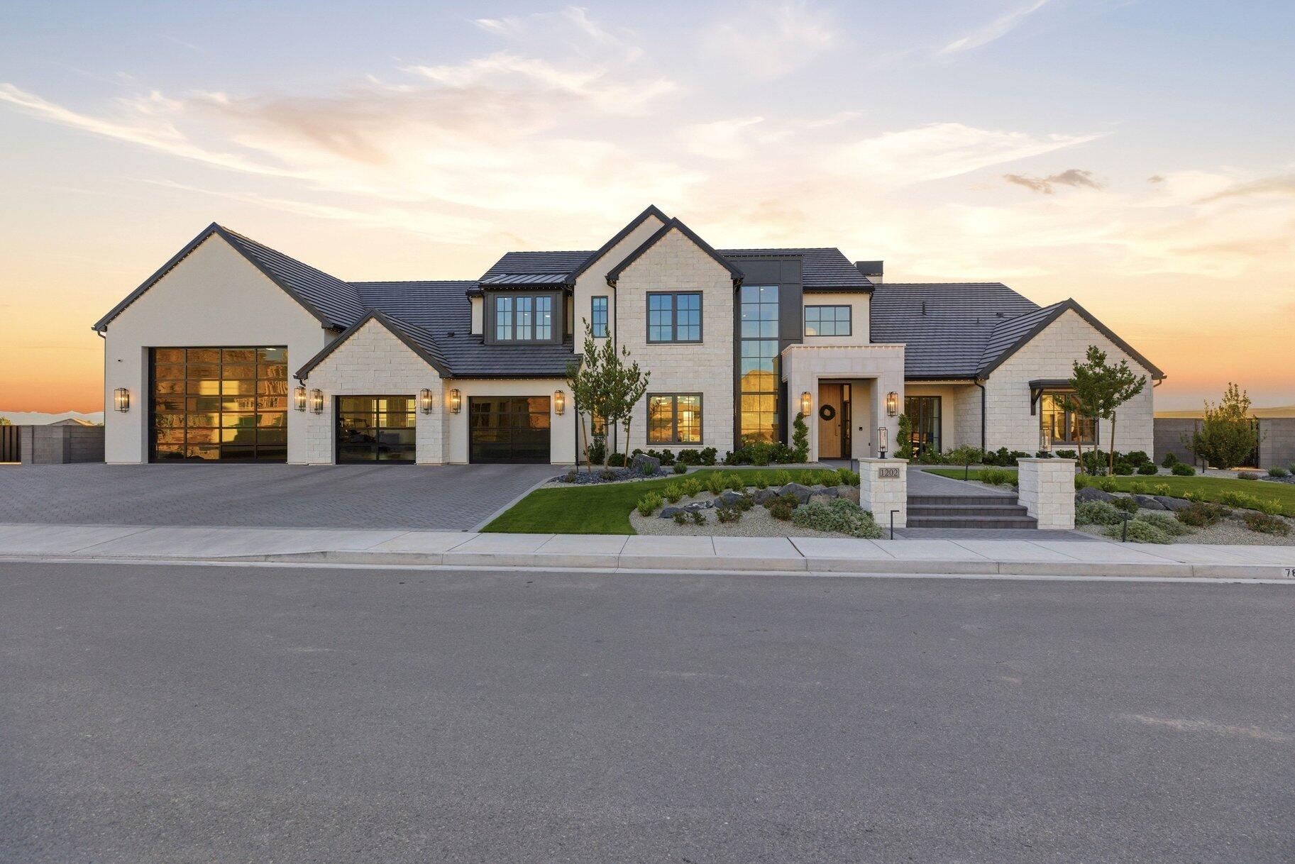Welcome to this amazing Indian Knolls stunner--a JW West Homes 2025 St. George Parade of Homes masterpiece. Built without compromise and designed for those who demand extraordinary, this 8,768 sq. ft. custom estate on .61 acres in Indian Knolls sets a new standard for luxury living in Southern Utah.

From the moment you step inside, the steel-frame glass-enclosed den announces the intention behind every detail. Wide-plank hardwood floors, soaring ceilings, and Prestige Woodworks custom cabinetry carry throughout every level. The show kitchen is anchored by a leathered Matarazzo marble island, Sub-Zero refrigerator and freezer columns, a Wolf 48'' dual-fuel professional range with brass bezels, and a full butler's pantry with its own dedicated appliance suite--engineered for effortless entertaining at any scale.

The primary suite is a private sanctuary featuring a spa-inspired bath in leathered White Pearl quartzite, a boutique walk-in closet, and an LG Styler steam system.

Below, the home transforms entirely. An indoor half-court basketball and full pickleball court--with a custom Jordan Jumpman logo, soaring ceilings, and a glass roll-up door opening directly to the pool deck--anchors a world-class athletic and wellness campus featuring a glass-enclosed gym with Rogue equipment, sauna, cold plunge, and light therapy. A rec room, custom bunk room, private salon, guest suite, and vault-door safe room complete the lower level.

Outside, Southern Utah's red rock canyon formations rise as a dramatic natural backdrop to a resort-caliber backyard by Palmer Pools, featuring a pool with waterslide, spa, fire features, covered pavilion with full outdoor kitchen, and a second outdoor pickleball court.

A fully integrated Control4 smart home system commands surround sound in every room and outdoors, lighting, climate, and pool automation--all from a single touch. Complete with an 8-car garage and RV bay, this estate is bold, exceptional, and unmatched.