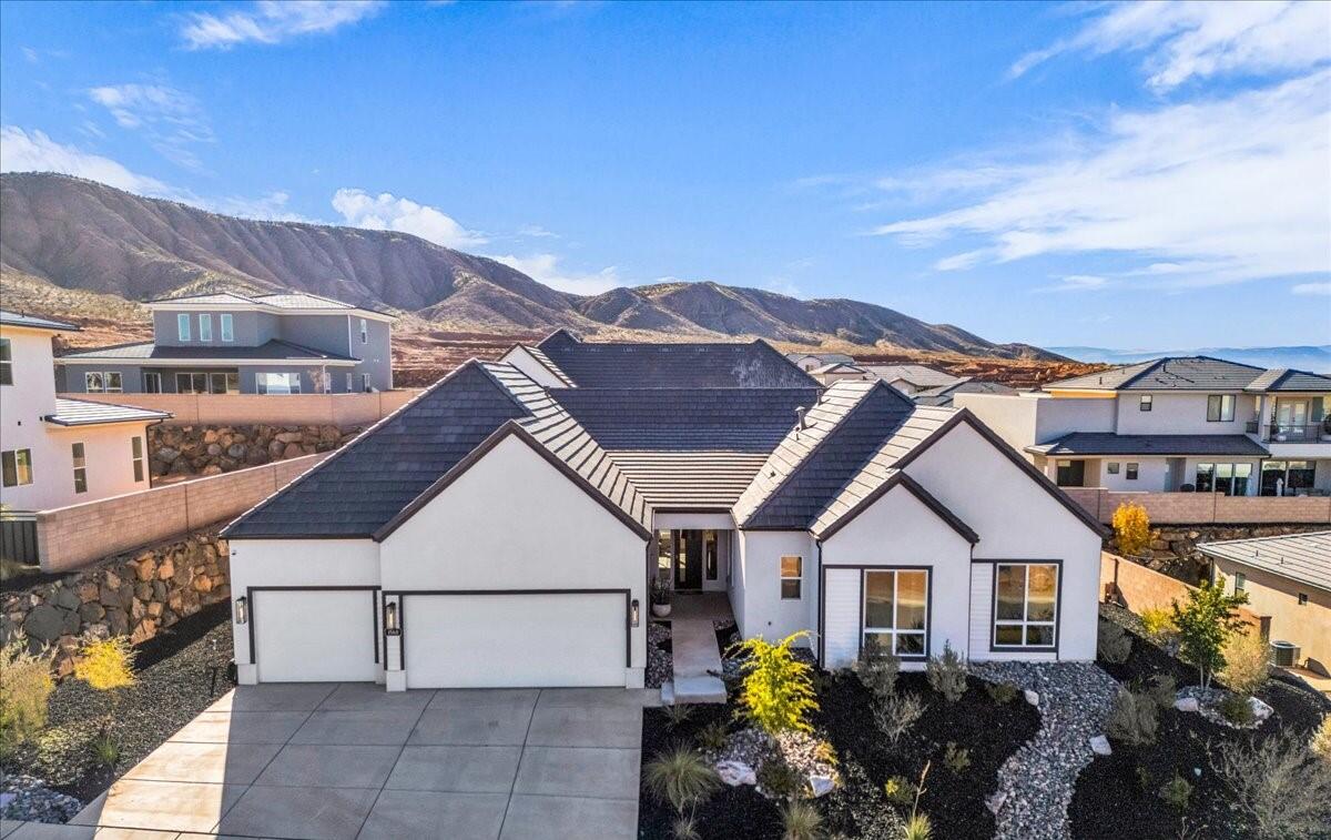 MOVE-IN READY - IMPECCABLY UPGRADED MODEL HOME! Welcome to this stunning model home in the desirable Shooting Star Community-showcasing the finest in modern design and thoughtful upgrades throughout. Step inside to discover a spacious, flowing layout with an open-concept floor plan designed for both everyday living and elegant entertaining. The heart of the home features a generous living area with custom built-in shelving and cozy fireplace, seamlessly connecting to a chef-inspired kitchen complete with an oversized island, abundant cabinetry with soft-close drawers, upgraded stainless appliances, and a convenient butler's pantry for additional prep space and storage. The adjacent dining area provides the perfect setting for gathering with family and friends. Retreat to the expansive primary suite, where luxury awaits with a spa-like ensuite featuring separate beautifully tiled shower and soaking tub, dual vanities, and an oversized walk-in closet with custom shelving systems. Three additional bedrooms-all with walk-in closets-offer comfortable accommodations, while a versatile flex space invites you to create your ideal home office, fitness room, reading nook, play area or whatever your vision! Step outside to your private, maintenance-free oasis: a professionally landscaped backyard featuring a patio, fire pit, and putting green with premium artificial turf-perfect for relaxation and recreation year-round. The spacious 3-car garage provides ample storage and parking. Don't miss this opportunity to own a turnkey, designer-upgraded home in one of the area's most sought-after communities!