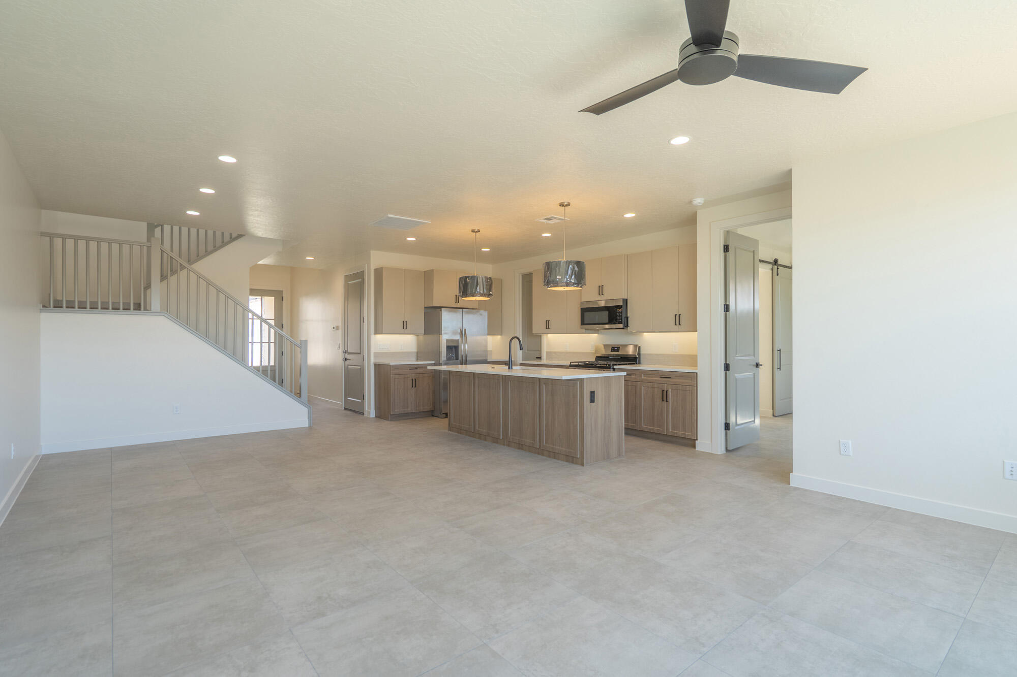 The Sole - This well-designed 4-bedroom, 2.5-bath home offers modern living with an open-concept layout connecting the spacious great room and stylish kitchen. Features include thermofoil cabinetry, granite countertops, a single-bowl stainless steel undermount sink, and a Frigidaire stainless steel appliance package with electric range, microwave hood, dishwasher, and refrigerator. Interior finishes include two-tone paint, tile flooring in main living areas, carpet in bedrooms, can lighting throughout, and ceiling fans in the living room and bedrooms. Bathrooms feature Moen plumbing fixtures and custom tiled showers/tub surrounds. Additional highlights include a laundry room with sink cabinet, extended finished garage with 50-amp EV breaker and room for a workshop or toys, block walls, and backyard space. Community amenities include a pool, hot tub, pool house, pickleball court, playground, and RV parking. Photos of similar home. Same floor plan; finishes, colors, and layout orientation may vary.
Builder incentives available with preferred lender. Qualified buyers may obtain:
• Conventional 7/6 ARM - initial interest rate ~5.50% on an adjustable-rate mortgage (ARM), fixed 7 yrs, adjusts semiannually
• FHA 5/1 ARM - initial interest rate ~4.75% on an adjustable-rate mortgage (ARM), fixed 5 yrs, adjusts annually
Seller contributes 2.5% + lender contributes 1.5% (with Guild Mortgage), which may be used toward a temporary rate buydown, closing costs, and/or prepaids--reducing initial monthly payments. Lender Incentives available only when financing is obtained through Matt Hickman at Guild Mortgage.OAC. Rates subject to change. APR may be higher.