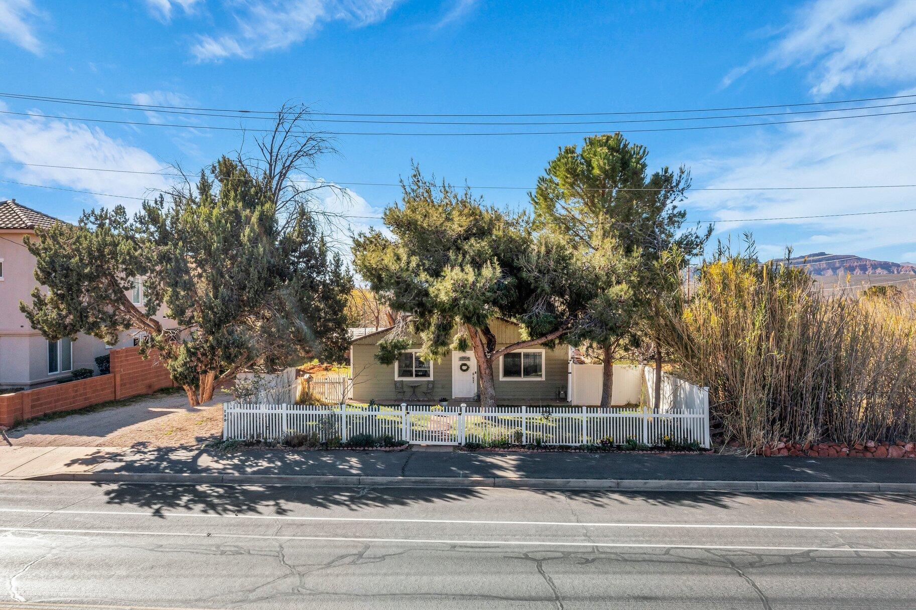 This rare 0.60-acre residential parcel in the heart of Ivins represents a compelling investment and development opportunity where the land's long-term upside significantly outweighs the existing single-family home. In a market where larger infill lots with Red Mountain views are increasingly scarce, this property offers immediate income potential today and substantial value creation through strategic development tomorrow.



Zoning and Ivins City's forward-looking planning support thoughtful density increases, including potential multifamily, duplex/twin home configurations, ADUs, or subdivision -- creating a clear path to higher returns as Southern Utah's population and demand for housing continue to surge. Savvy investors can leverage the City's approval process for enhanced residential uses while benefiting from strong rental demand in this desirable location right now.



Prime location amplifies the investment thesis: walkable to Ivins City Park, near a charter school and Red Mountain Market, and just minutes from Tuacahn Amphitheatre, Black Desert Resort, Entrada, and world-class recreation. This central position in one of Washington County's fastest-appreciating areas positions the property for strong appreciation and quick absorption of new units.

For developers and investors seeking land-banked opportunities with lifestyle upside in Southern Utah's red rock corridor, this is a limited chance to secure a flexible, oversized lot in an established neighborhood with proven demand. The investment math is straightforward: acquire now at current pricing, capture rental income during entitlement, then unlock multiplied value through approved density.

Serious investors -- schedule a private tour today and let's discuss how this property aligns with your portfolio goals. Don't wait for the next wave of growth to price you out.