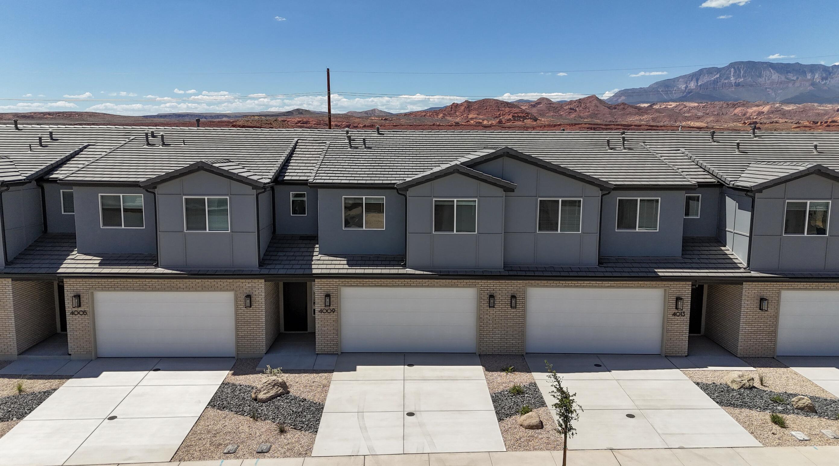 Step into The Sunrise, where versatile living meets spacious comfort. Nestled in Coral Canyon, this end-unit 2 story townhome, with 4 bedrooms and an open-concept design, is bathed in natural light from its abundant windows. Thoughtfully crafted for both relaxation and activities, the home features dual vanities, walk-in closets, and ample storage to keep life stylishly organized. The large great room and central kitchen island create the perfect setting for everyday adventures and memorable gatherings in the welcoming Coral Canyon community.