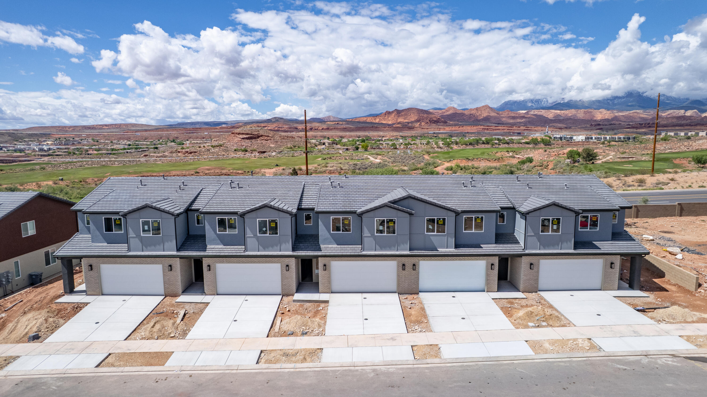 Step into The Sunrise, where versatile living meets spacious comfort. Nestled in Coral Canyon, this end-unit 2 story townhome, with 4 bedrooms and an open-concept design, is bathed in natural light from its abundant windows. Thoughtfully crafted for both relaxation and activities, the home features dual vanities, walk-in closets, and ample storage to keep life stylishly organized. The large great room and central kitchen island create the perfect setting for everyday adventures and memorable gatherings in the welcoming Coral Canyon community.