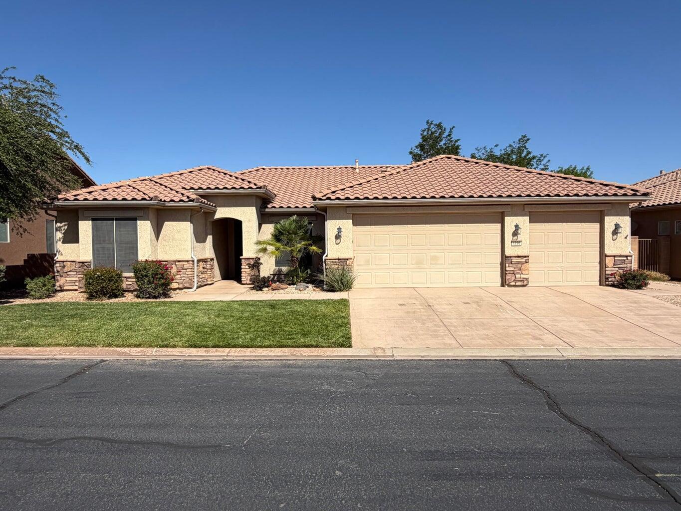 Welcome to this beautiful home in the highly sought-after Sun River 55+ community! Situated on a premium lot, this property offers a large private backyard perfect for relaxing, entertaining, or enjoying the peaceful surroundings. Inside, you'll find a spacious open-concept floor plan with large rooms, 3 bedrooms, and 2 bathrooms designed for comfortable living. The oversized 3-car garage provides plenty of storage and parking space. As an added bonus, the hot tub is included! Enjoy all the amenities, activities, and lifestyle that make Sun River one of Southern Utah's most desirable active adult communities.