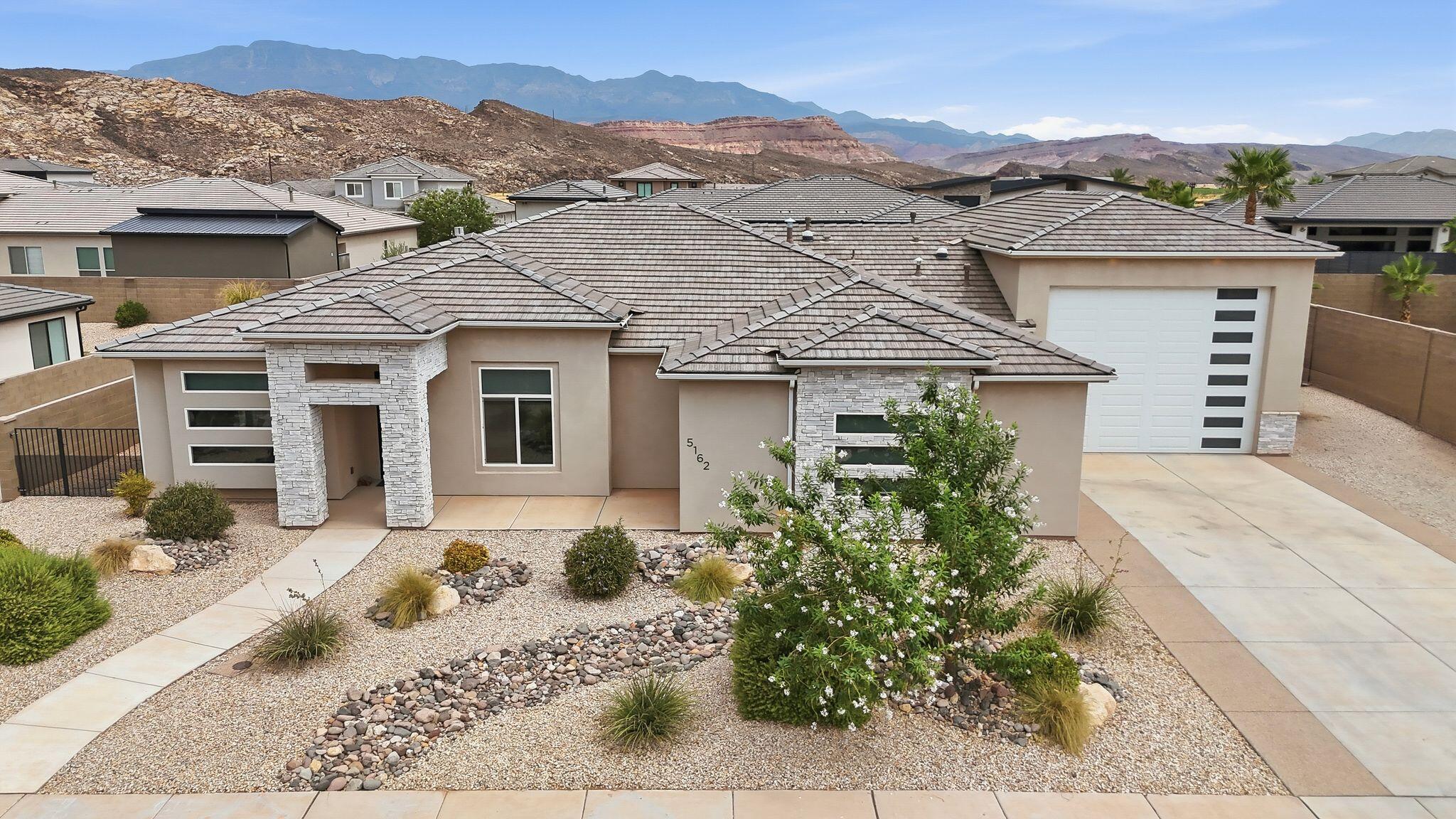 Beautifully maintained 4-bedroom, 2.5-bath home in desirable Pecan Valley offering approx. 2,600 sq ft of open-concept living. The spacious family room features a custom built-in entertainment center and cozy gas fireplace, creating the perfect gathering space. The kitchen flows seamlessly into the living and dining areas, enhancing the bright, inviting layout. Fresh new carpet throughout and ceiling fans in key living spaces add comfort and a move-in-ready feel.
The private primary suite offers a relaxing retreat, with a solar tube bringing natural light into the bath. An additional solar tube brightens the half bath. 
The oversized, extra deep 4-car garage with EV charger. Exceptional space for vehicles, an RV, boat, storage, and recreational gear. Recent upgrades include an instant-on tankless water heater for endless hot water and improved efficiency.
Enjoy outdoor living with a covered patio, swim spa, and basketball pad--ideal for entertaining and relaxing. Located less than 5 minutes from Sand Hollow Reservoir and Sand Hollow Golf Course, this home offers unbeatable access to boating, fishing, golfing, hiking, biking, ATV trails, and more. Shopping, restaurants, and everyday conveniences are just minutes away. Beautifully maintained 4-bedroom, 2.5-bath home in desirable Pecan Valley offering approx. 2,600 sq ft of open-concept living. The spacious family room features a custom built-in entertainment center and cozy gas fireplace, creating the perfect gathering space. The kitchen flows seamlessly into the living and dining areas, enhancing the bright, inviting layout. Fresh new carpet throughout and ceiling fans in key living spaces add comfort and a move-in-ready feel.
The private primary suite offers a relaxing retreat, with a solar tube bringing natural light into the bath. An additional solar tube brightens the half bath. 
The oversized, extra deep 4-car garage with EV charger. Exceptional space for vehicles, an RV, boat, storage, and recreational gear. Recent upgrades include an instant-on tankless water heater for endless hot water and improved efficiency.
Enjoy outdoor living with a covered patio, swim spa, and basketball pad--ideal for entertaining and relaxing. Located less than 5 minutes from Sand Hollow Reservoir and Sand Hollow Golf Course, this home offers unbeatable access to boating, fishing, golfing, hiking, biking, ATV trails, and more. Shopping, restaurants, and everyday conveniences are just minutes away.