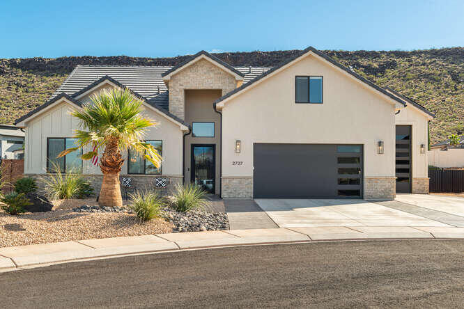Welcome to this exceptional home in one of Hurricane's most desirable neighborhoods. Designed for luxury, comfort, and entertaining. Featuring a bright, open layout with generous living spaces, this home offers custom cabinetry throughout and a chef's kitchen equipped with high-end appliances including ice maker, hidden pantry with coffee bar. The oversized primary suite is a luxurious haven, completed with a spa like bath that includes a walk in shower, tub, dual sinks plus a spacious walk in closet. Step outside to the a stunning backyard featuring a private pool with slide, covered patio, and plenty of room for entertaining.  The home is equipped with an Indoor/Outdoor audio/video system. Bring all your toys as there is plenty of room in the garagage.  The attached RV garage is 34' deep. This home is the ideal location that provides easy access to Sand Hollow, hiking/biking trails and more.  The hot tub and home furnishings are available for purchase.  Sellers hold Utah real estate licenses.