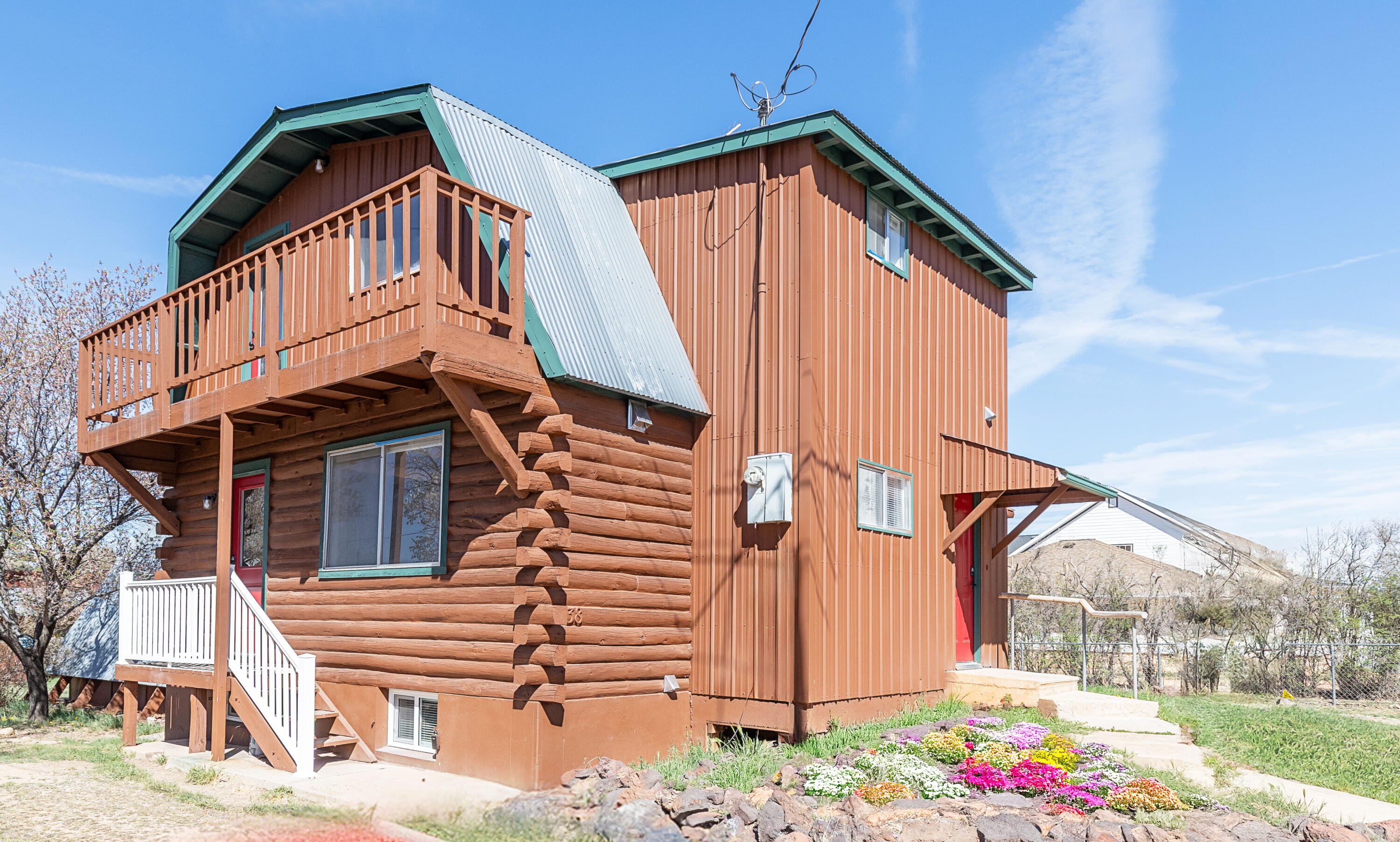 Nestled in the serene community of Parowan,this unique cabin with an English cottage vibe blends timeless character with modern updates.  The inviting living room and eat-in kitchen showcasen originaln wood plank walls, beautifully complemented by swiss coffee paint that creates a warm, cozy atmosphere.  The thoughtfully renovated basement offers exceptional flexibility, featuring two bedrooms, a full bath, and a kitchen, making it ideal for guests, multi-generational living, or potential rental income.  Enjoy peaceful mornings and stunning surroundings from two outdoor balconies, perfect for taking in the view and the tranquility of the area.  A versatile bonus room featuring a charming mid-century fireplace can serve as a home office, game room or 5th bedroom.  This-one-of-a-kind property offers character, versatility, and the opportunity to enjoy the best of Parowan living.