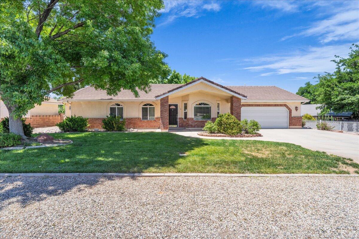 Located in the highly desirable Bloomington Hills area of St. George, this beautiful 3-bedroom, 2-bath home offers nearly 1,900 square feet of comfortable living in one of the quietest neighborhoods in town. With NO HOA, you'll enjoy the freedom and flexibility homeowners are looking for. The property features RV parking, a large fully fenced in backyard perfect for kids, entertaining, and storing all your toys, and an unbeatable location close to parks, trails, schools, shopping, and everything St. George has to offer. Whether you're looking for a peaceful place to call home or a property with room to spread out, this property checks all the boxes!