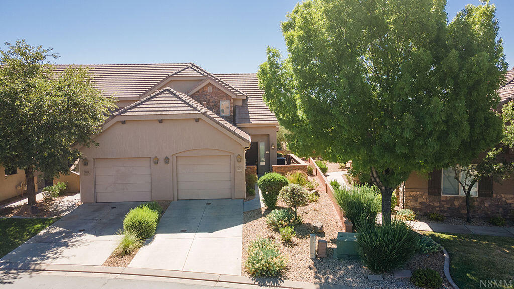 This beautiful end-unit townhome is part of a nightly rental community that offers resort style amenities, like two large pools and two spas. Situated on a premium lot, there is a large open space behind the home, offering privacy, light, and views of the nearby pond from the back patio. Included with the home are turn-key essentials like furniture, washer/dryer, kitchen appliances, and water softener. Zoned for nightly and short term rentals, this property could be used as an investment or a personal getaway to enjoy all things Southern Utah.