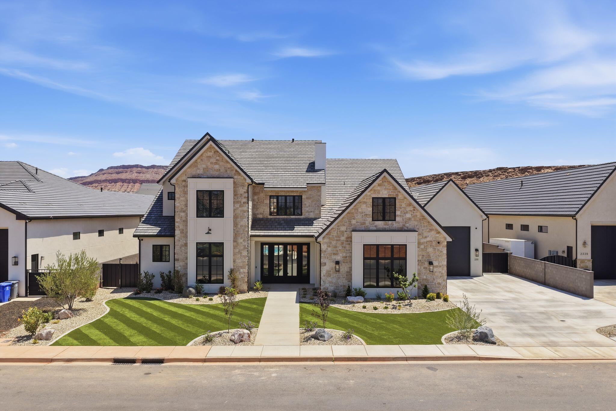 Located in one of the most prestigious and sought-after areas of St. George, this extraordinary luxury estate at 2315 S Crimson Cliffs Way offers an unmatched combination of craftsmanship, scale, and resort-style living. Spanning 7,591 square feet, this custom-designed residence was built with exceptional attention to detail, featuring soaring 12-foot ceilings on the main level, 10-foot ceilings upstairs, premium Andersen windows, and energy-efficient 2x6 exterior construction for enhanced insulation and comfort.

Designed for both elevated everyday living and unforgettable entertaining, the home includes 6 spacious bedrooms, 8 full bathrooms, and 1 half bath, along with an additional custom bunk room that comfortably accommodates extra guests. The thoughtfully designed floor plan offers dual laundry rooms, a dedicated office, a large recreation room on the main floor, and an expansive upstairs loft perfect for gathering, gaming, or relaxing. Luxury finishes and high-end custom cabinetry are showcased throughout the entire home, while the grand entry creates an immediate sense of sophistication and scale.

The outdoor amenities rival those of a private resort. Enjoy a stunning 20x40 pool with a raised 8x8 spa, a full 30x60 pickleball court, generous outdoor living space, and incredible Southern Utah weather year-round. Car enthusiasts and adventure seekers will appreciate the oversized 3-car garage in addition to a massive RV garage with room for an RV, boats, toys, or additional vehicles.

Positioned near some of St. George's most desirable attractions, this home offers convenient access to championship golf courses, hiking and biking trails, Sand Hollow Reservoir, Tuacahn Center for the Arts, Zion National Park, luxury dining, shopping, and top-rated schools. Buyers seeking a premier Southern Utah lifestyle will appreciate the rare combination of luxury, recreation, privacy, and location that this exceptional property provides.