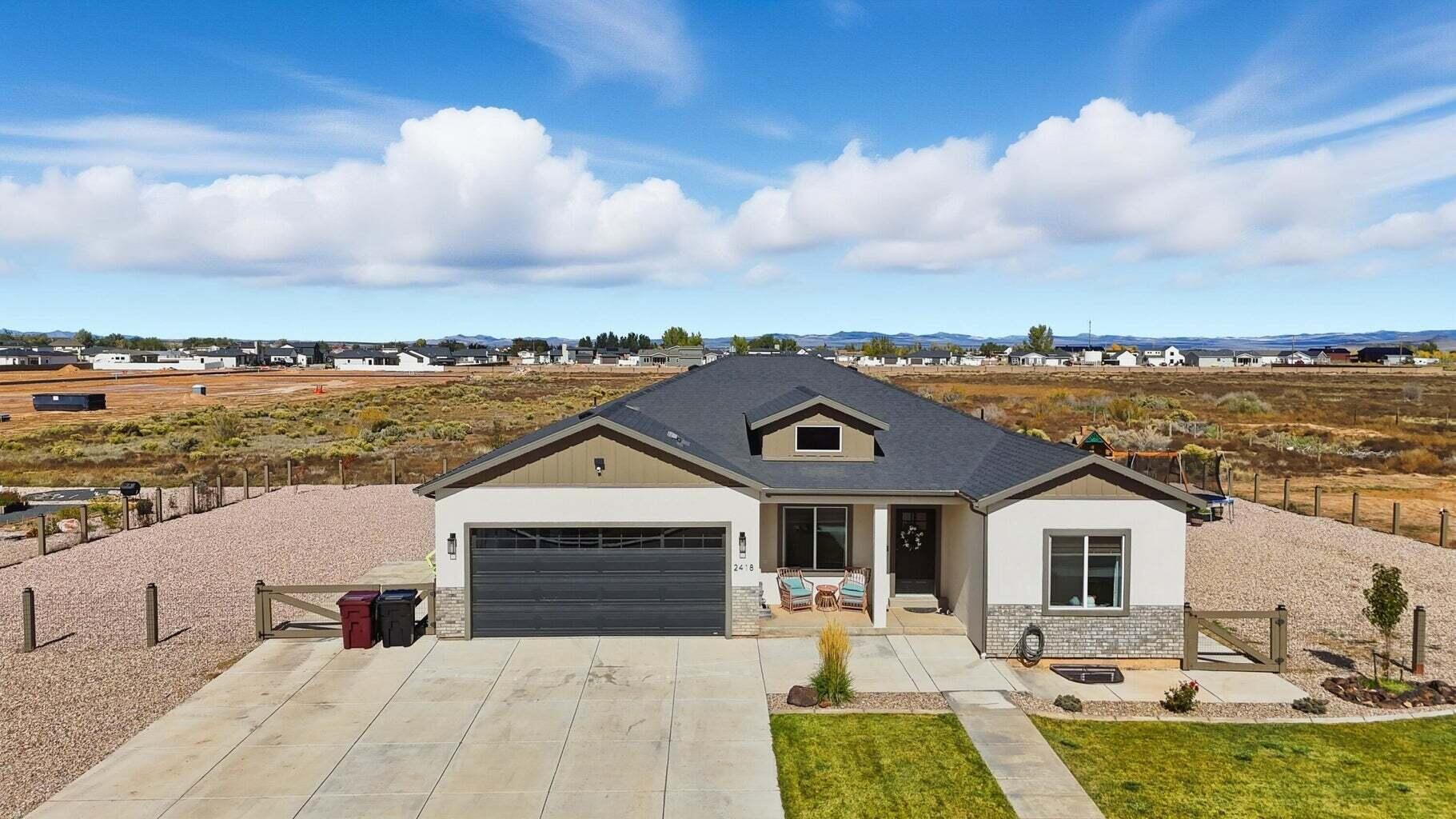 Experience the perfect blend of peaceful country living and modern convenience just minutes from Cedar City. This exceptional 5 bedroom, 4 bathroom home offers 3,298 sq. ft. of beautifully crafted living space designed for comfort, entertaining, and everyday luxury. Set in a highly desirable location with no HOA, this property captures the charm of wide-open living while keeping you close to shopping, dining, schools, and outdoor recreation. Inside, you'll find an inviting open-concept layout filled with warmth and natural flow. The custom kitchen is a true centerpiece, featuring upscale finishes, abundant workspace, and a reverse osmosis water system. The fully finished basement was designed with entertaining in mind, complete with a custom wet bar, spacious gathering areas, and a cozy fireplace that creates the perfect setting for hosting guests or relaxing evenings at home. Multiple fireplaces throughout the home add timeless character and an inviting ambiance. Retreat to the spa-inspired bathroom featuring a built-in sauna, offering a private escape to relax and recharge. Step outside to enjoy the covered patio overlooking the backyard, complete with room to play, entertain, and enjoy the peaceful surroundings. A children's play set is already in place, making this property as functional as it is beautiful. Offering privacy, space, and luxury without sacrificing convenience, this rare property truly delivers the best of both worlds.
