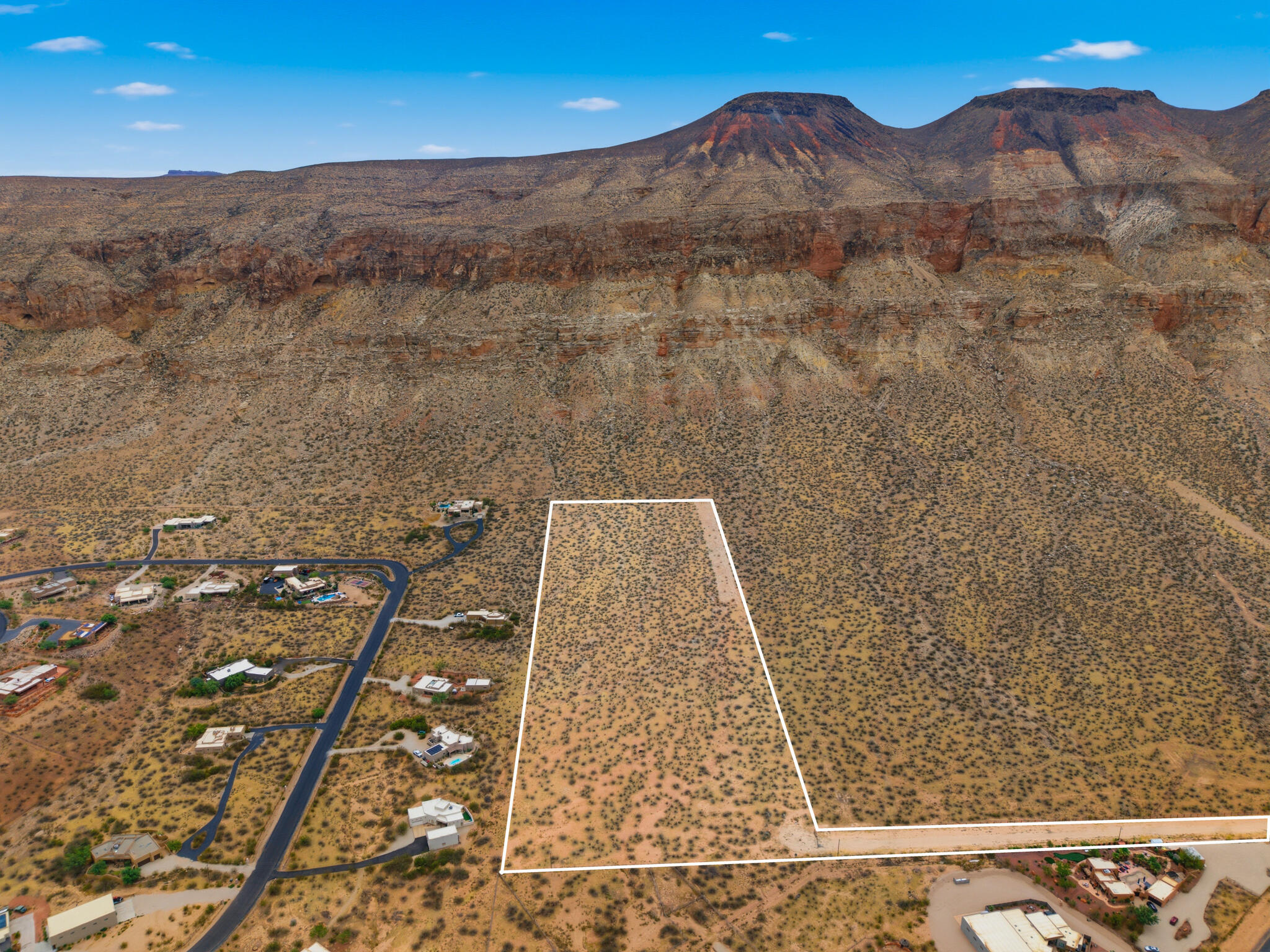 Exclusive 14.42-Acre Estate & Development Opportunity in Hurricane, Utah

Discover one of the premier land opportunities in Southern Utah. Situated in the highly desirable Moccasin Flats area of Hurricane, this exceptional 14.42-acre parcel is located directly across from Copper Rock Golf Course and just minutes from Sky Ranch Airstrip, offering a rare combination of privacy, convenience, and investment potential.

As one of the largest parcels in the development--and the only lot featuring private off-street access--this property offers incredible flexibility. Build your dream estate with room for horses, livestock, and all your recreational toys, or explore the opportunity to subdivide the property into approximately 10 to 12 one-acre parcels (subject to city approvals), creating an exceptional investment or residential development opportunity.

Enjoy breathtaking panoramic views of Pine Valley Mountain, Sand Hollow Reservoir, and Copper Rock Golf Course, with Sand Hollow State Park, Sand Mountain, world-class golf, boating, hiking, and thousands of miles of UTV/ATV trails just minutes away.

Zoned RA-1 (Residential Agricultural), the property allows for both residential and agricultural uses, providing endless possibilities for a luxury estate, equestrian property, family compound, or future residential development.

Utilities are already in place, with city water and power stubbed to the front of the property, a fire hydrant located on-site, and a valuable water right included.

Additional benefits include eligibility for the Greenbelt Tax Advantage, which can significantly reduce annual property taxes.

No HOA. Whether you're looking to build an extraordinary private estate or unlock the potential of 10 to 12 future one-acre homesites, this is a rare opportunity to own one of Hurricane's most versatile and desirable land offerings.